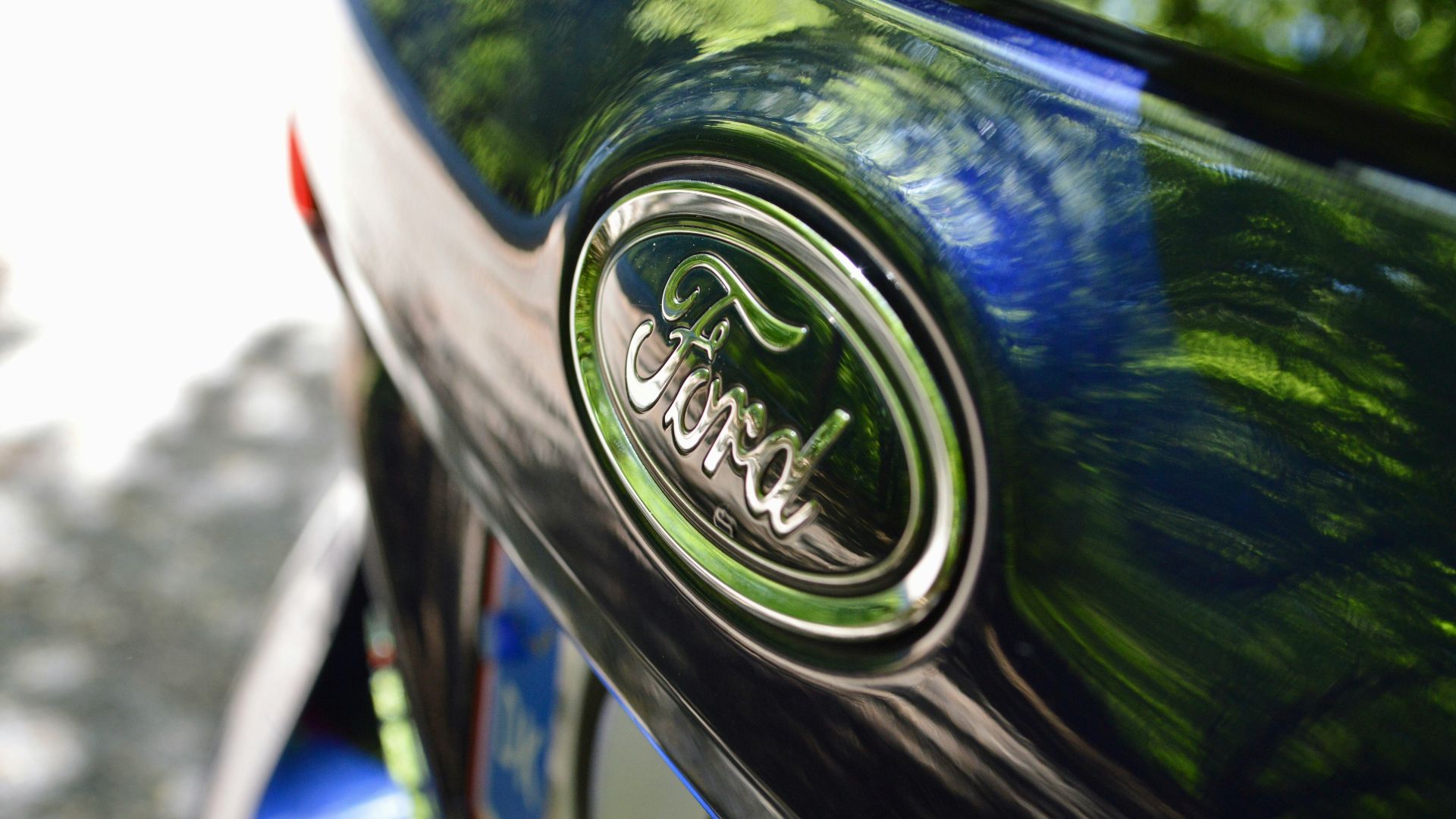 green and silver nissan car