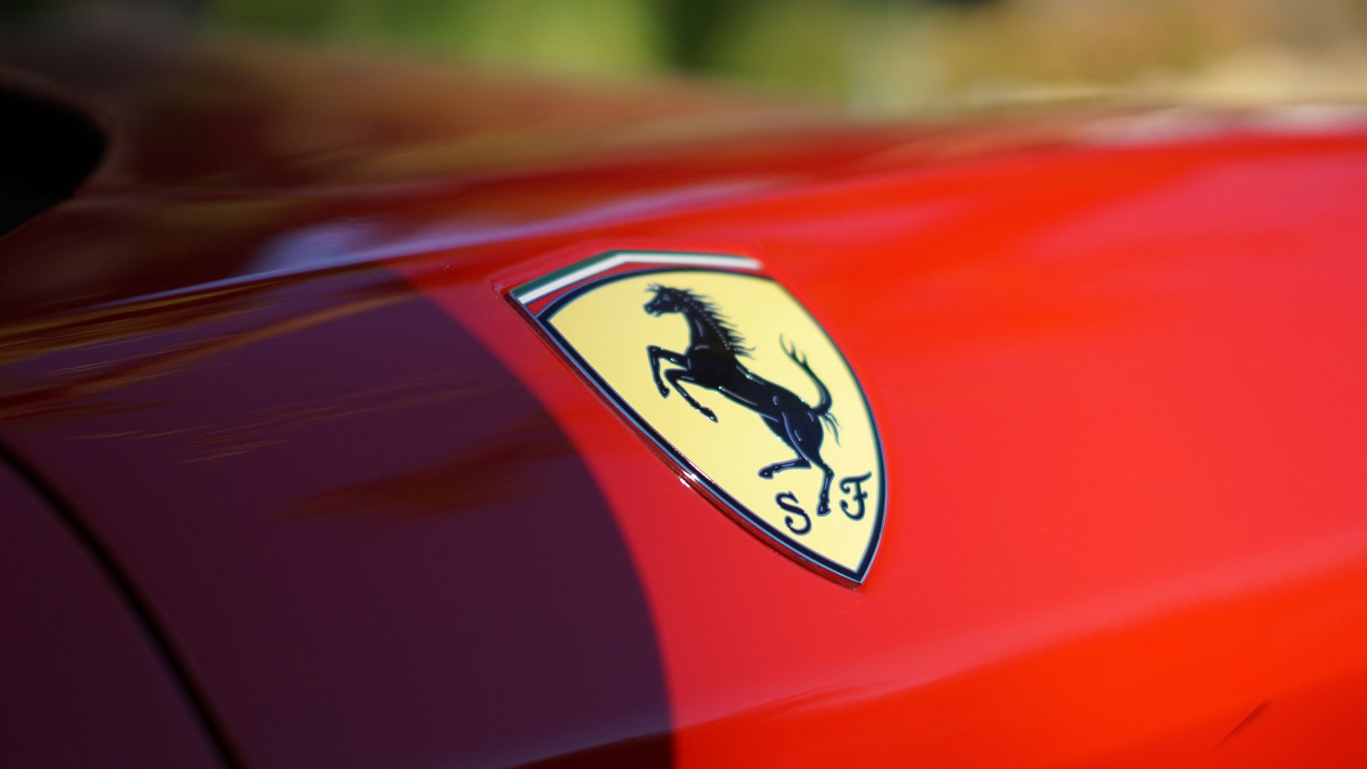 red car with yellow and black logo