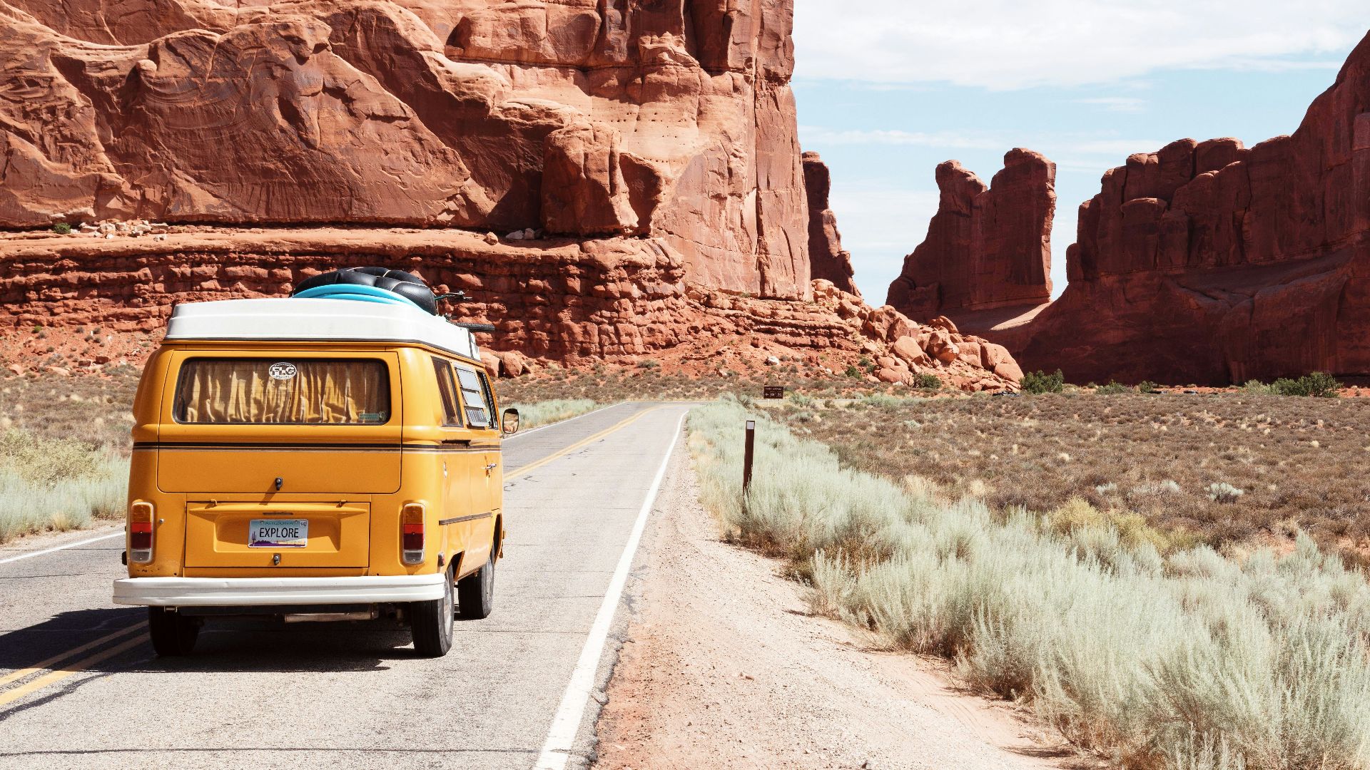 yellow Volkswagen van on road