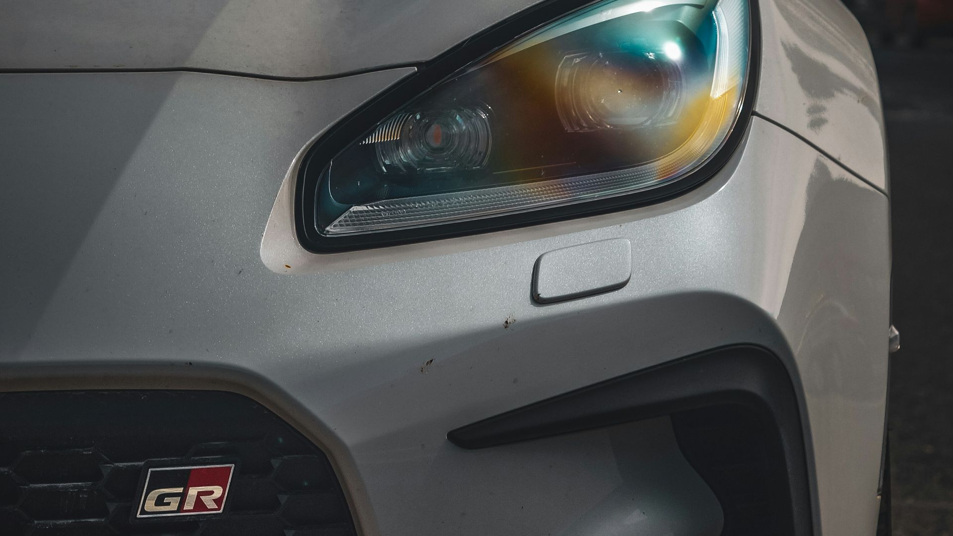 a close up of the front of a sports car