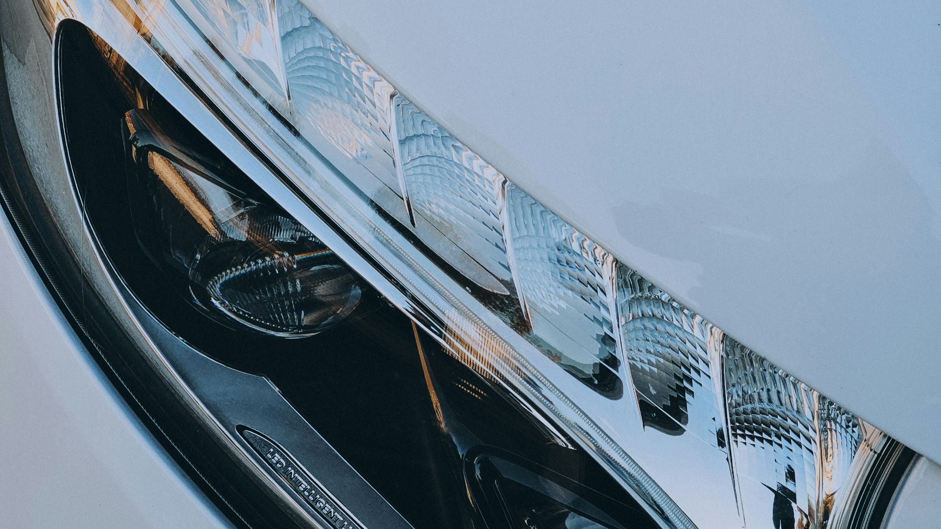 a close up of a white car headlight