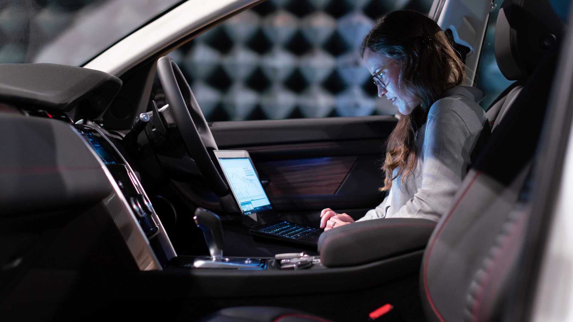 woman in white jacket sitting on car seat
