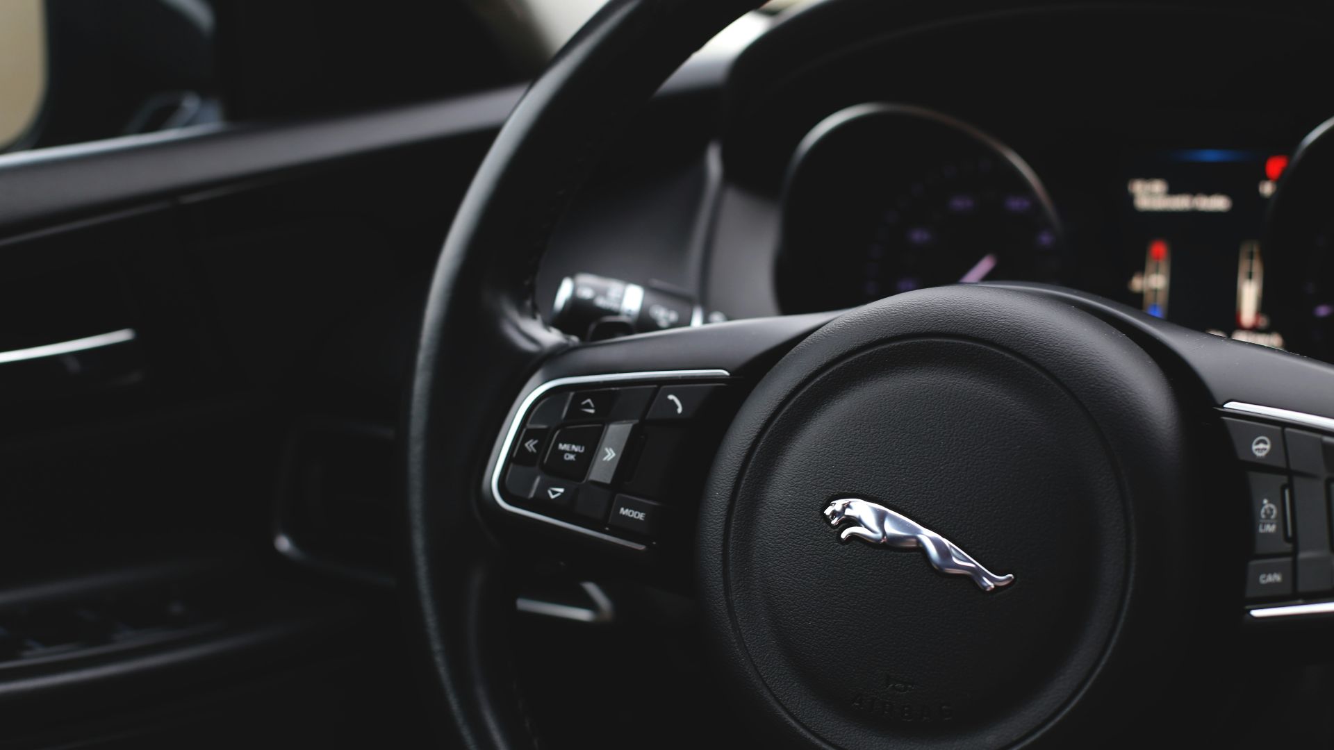 black and gray audi steering wheel