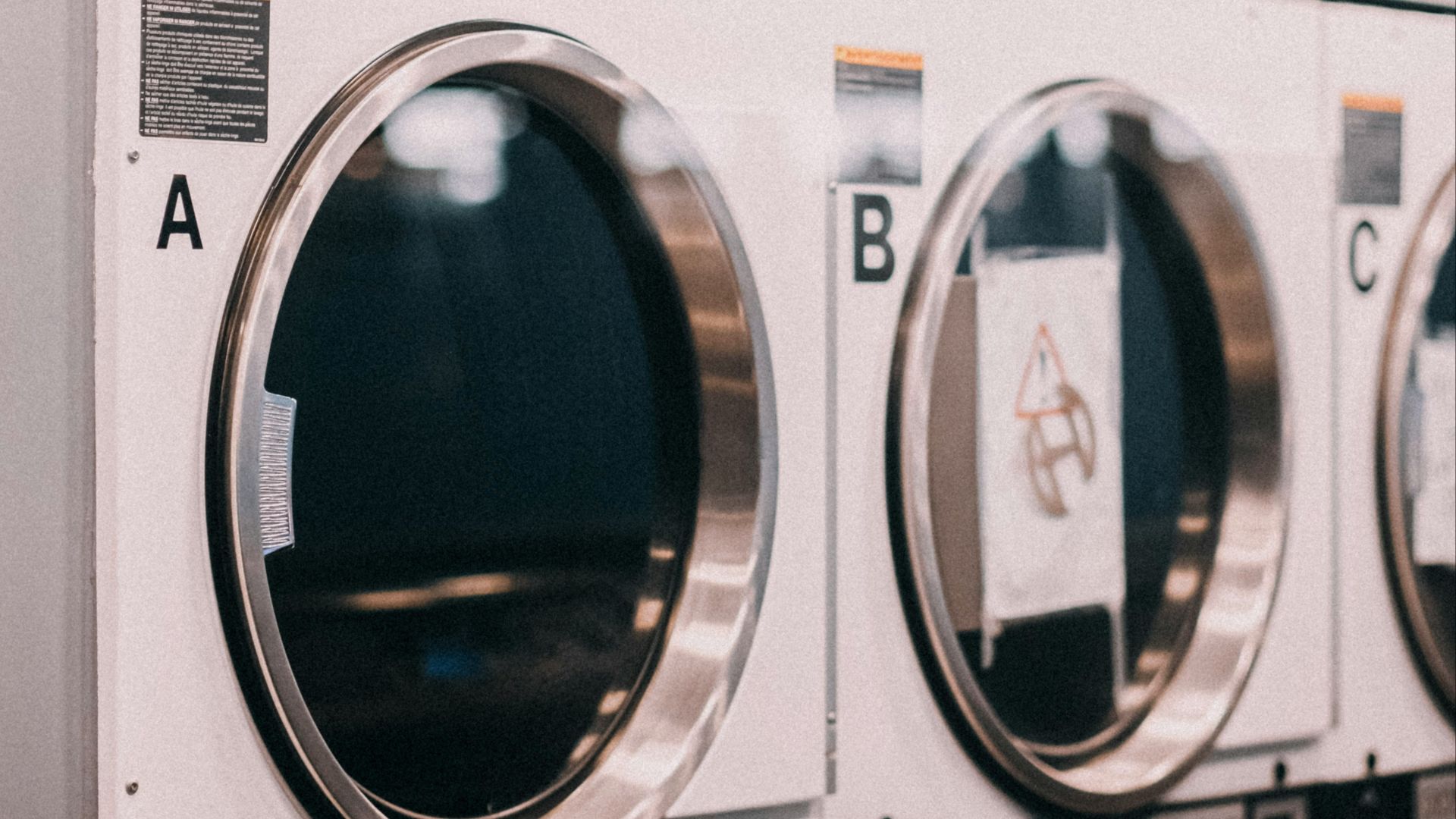a row of washers sitting next to each other