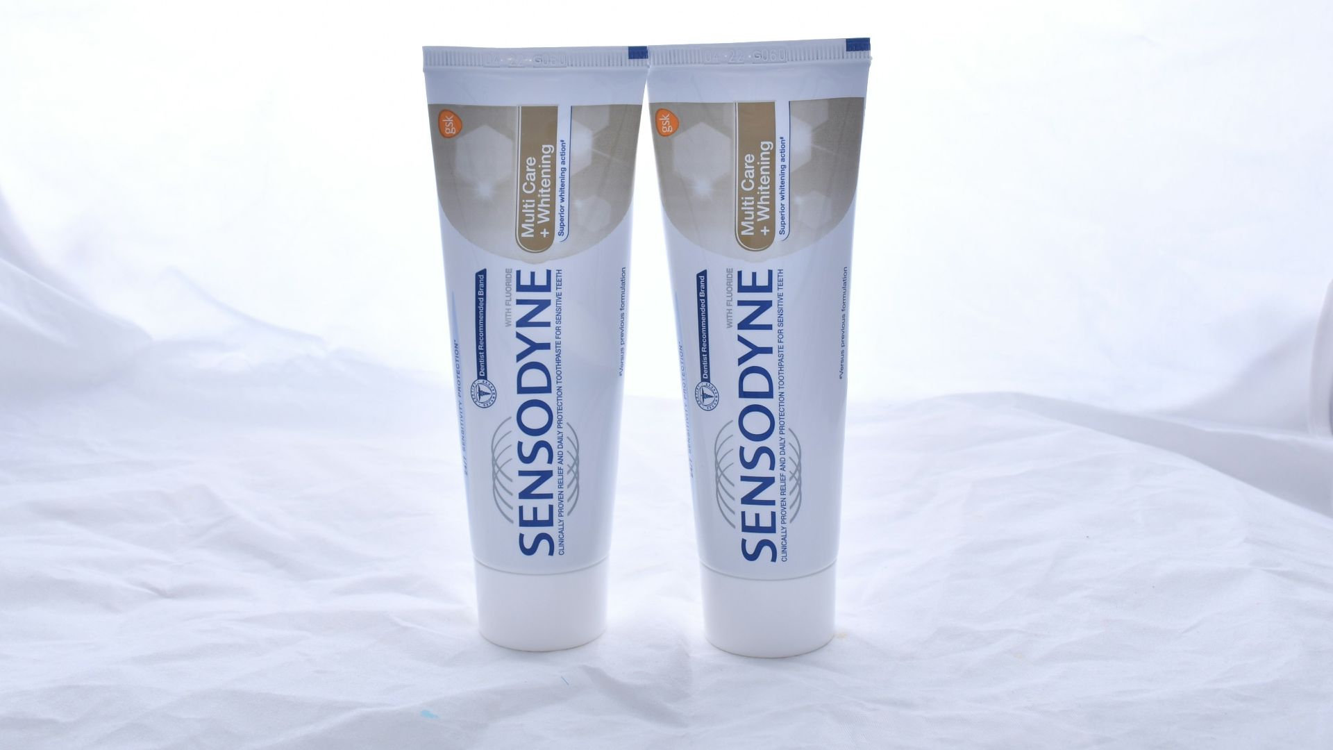 white and black plastic tube bottle