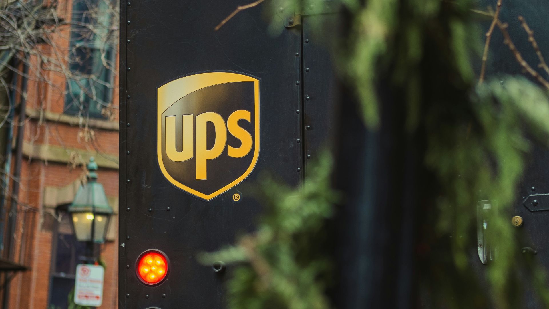 a ups bus parked on the side of the road