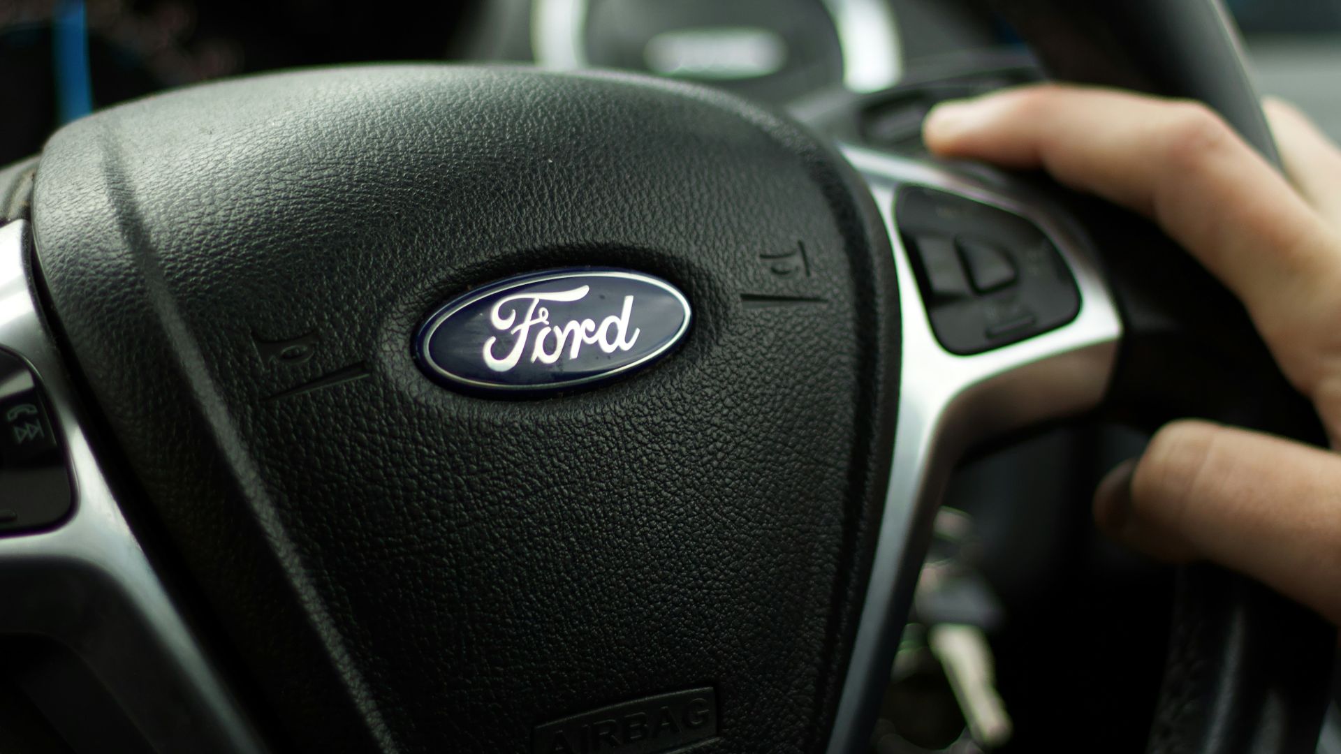 black nissan car steering wheel