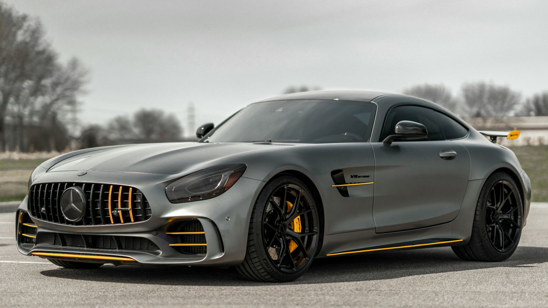 black mercedes benz coupe on gray asphalt road