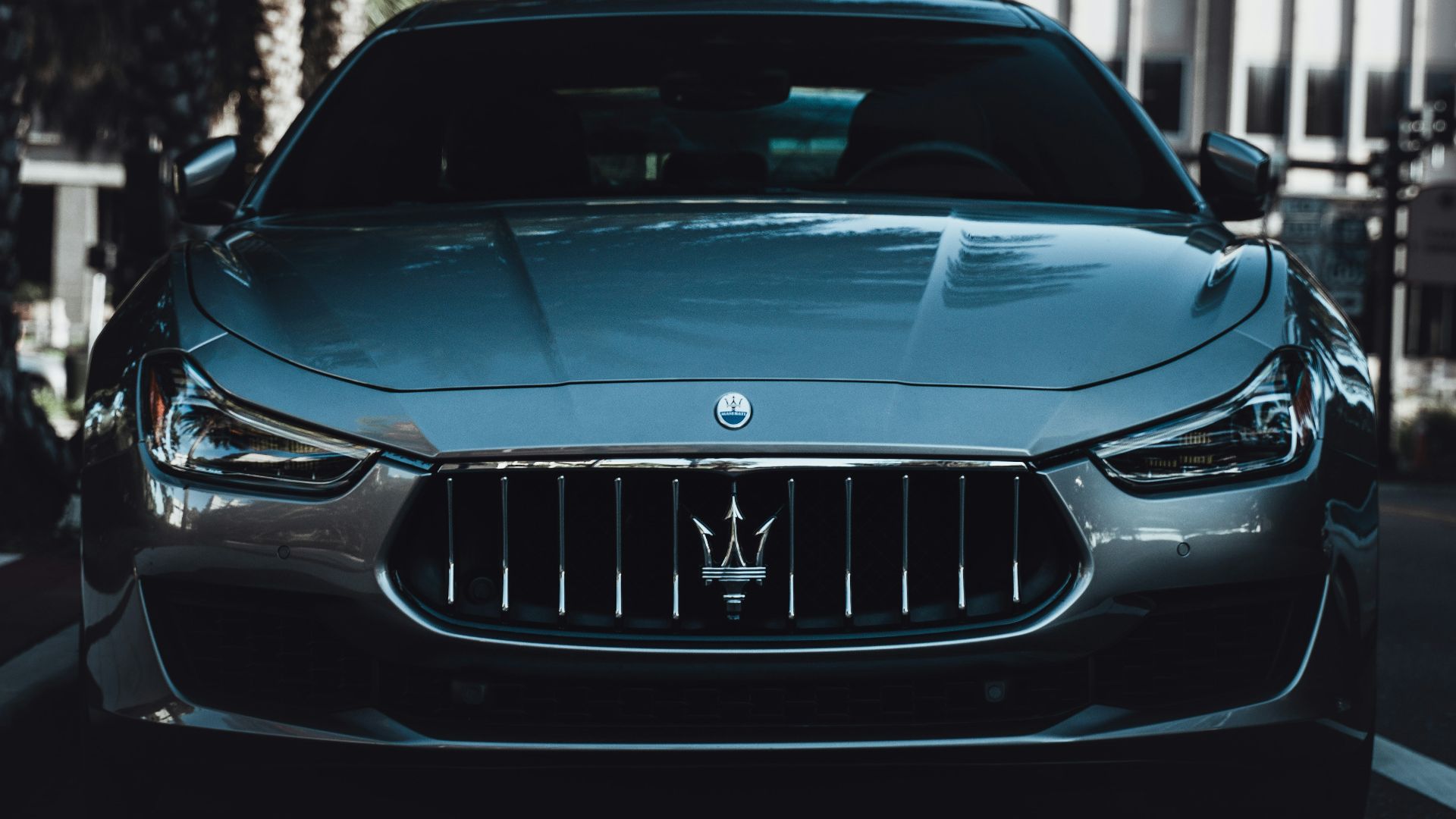 black bmw m 3 parked on sidewalk during daytime