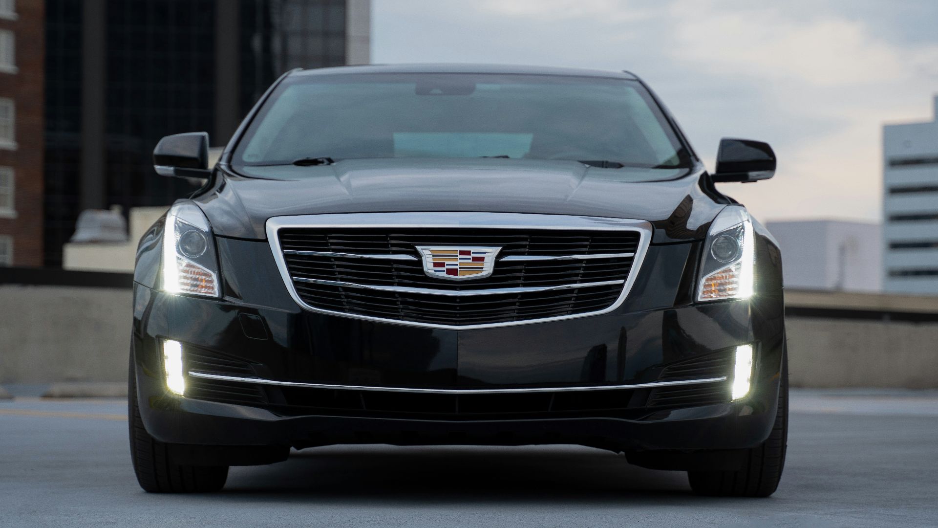 black chevrolet camaro on road during daytime