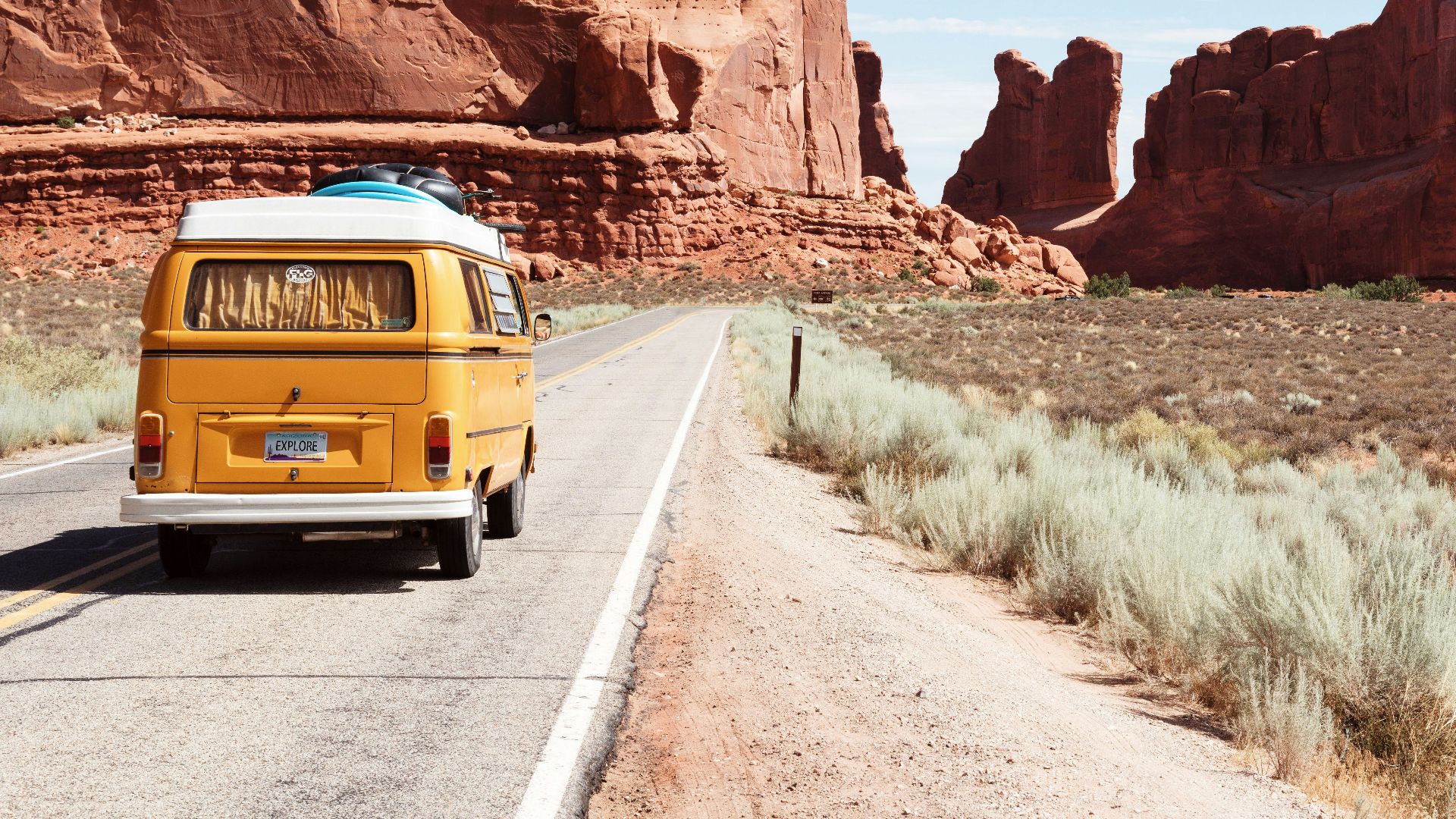 yellow Volkswagen van on road