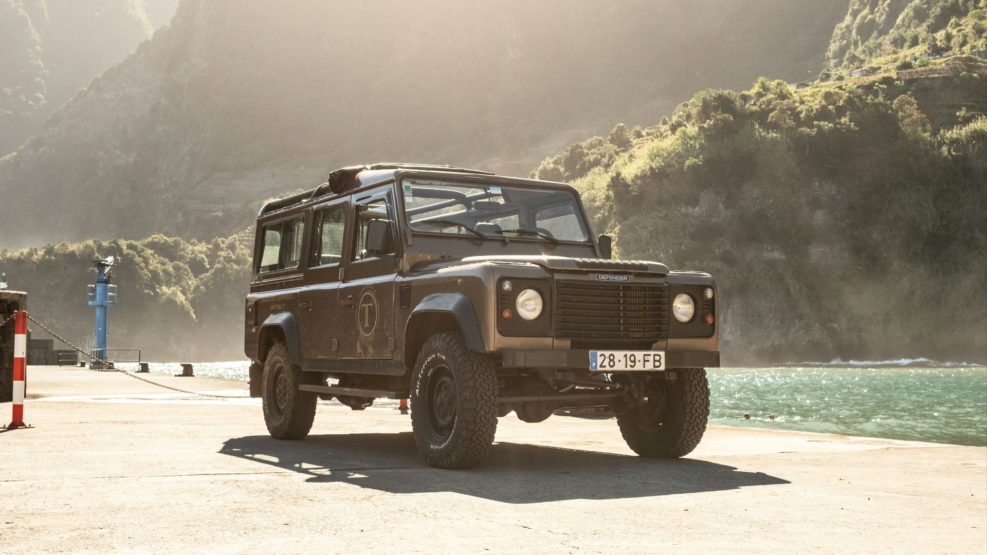 a jeep is parked on the side of the road
