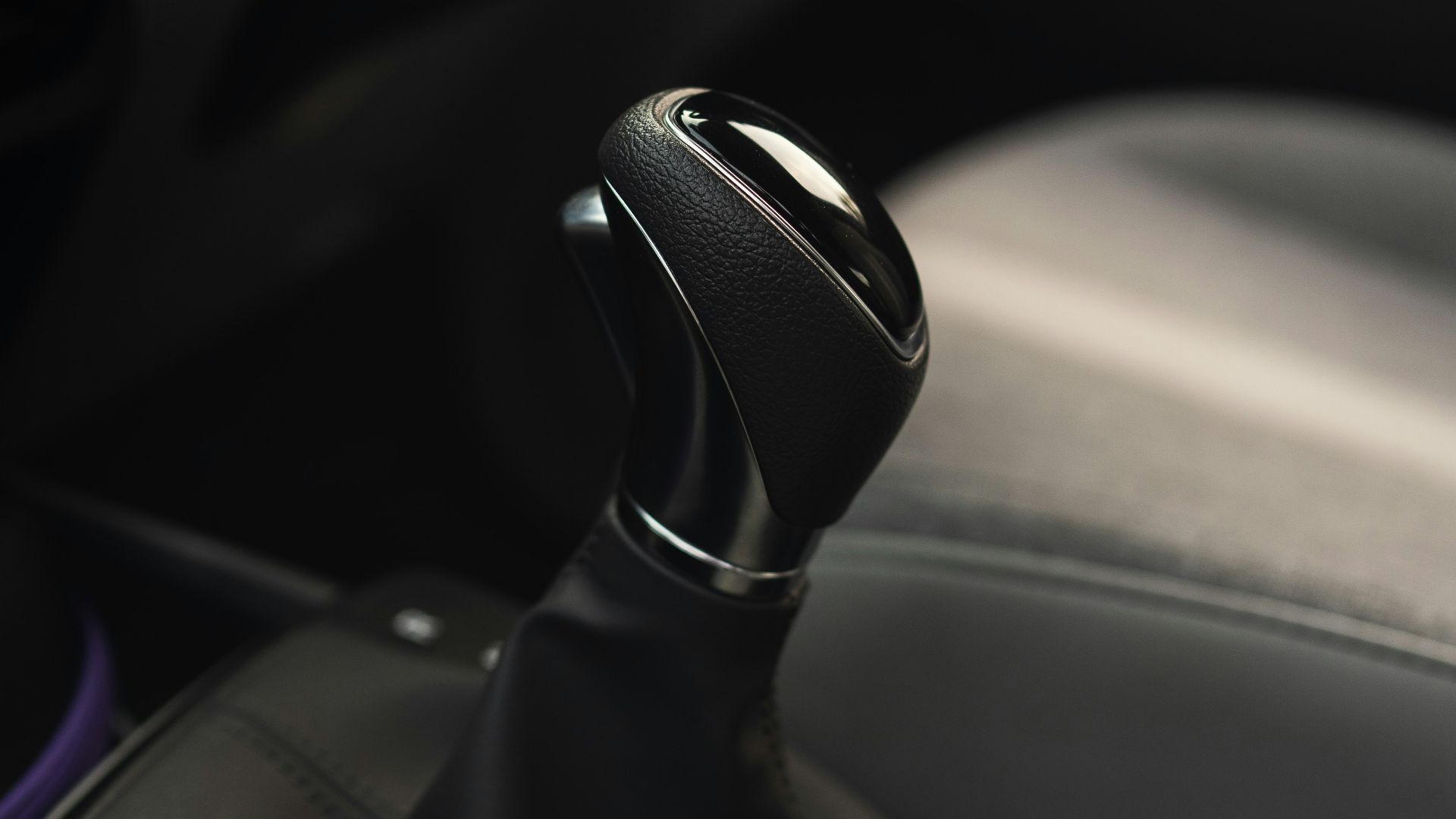 black and silver car gear shift lever