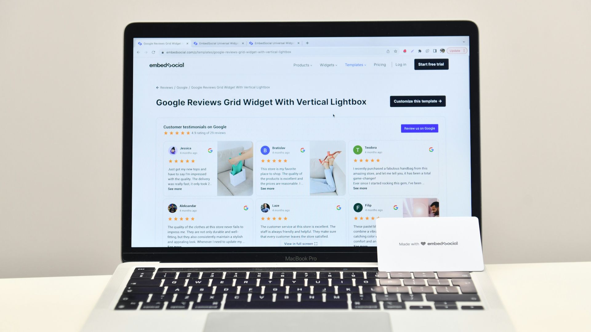 a laptop computer sitting on top of a white desk