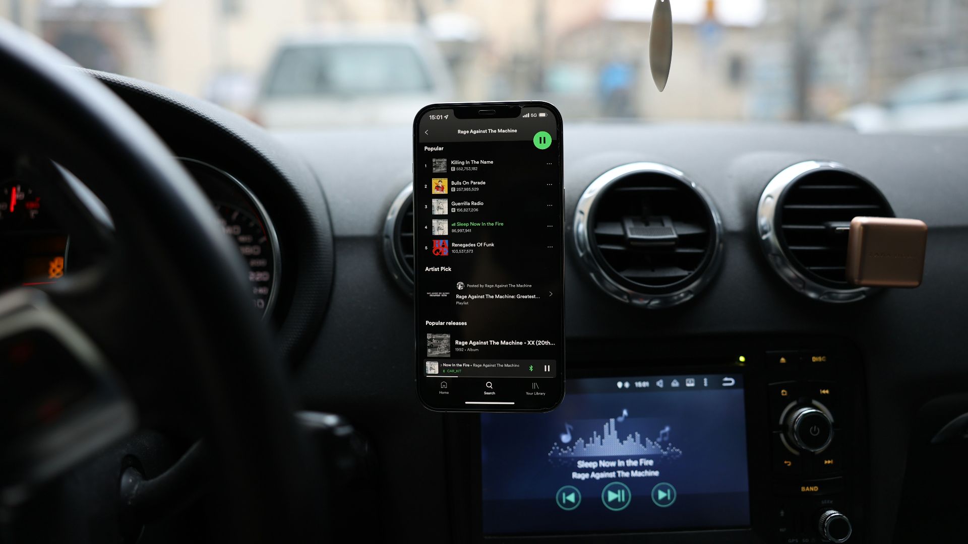 a car dashboard with a cell phone and gps