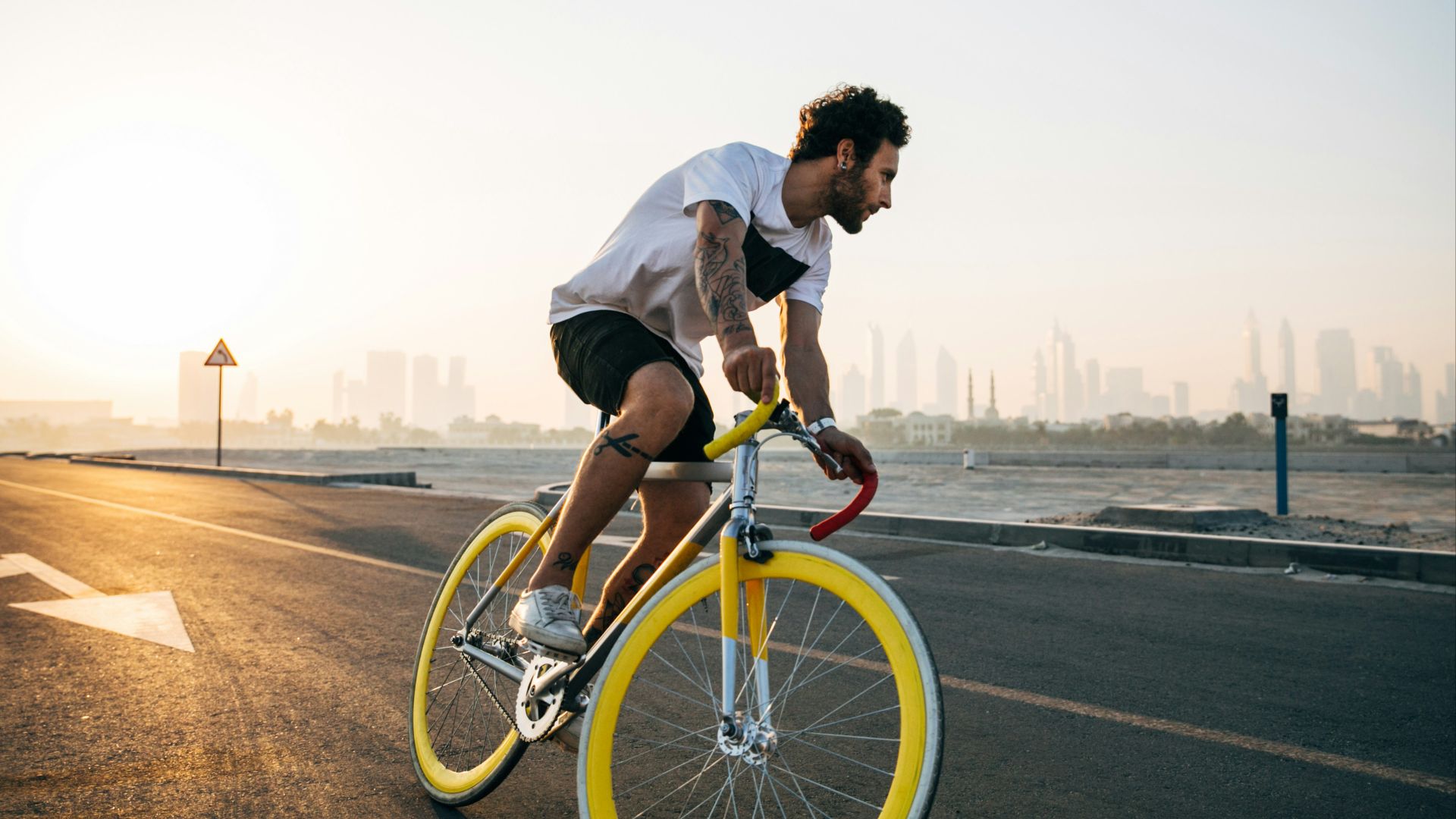 man riding bicycle on road during daytime