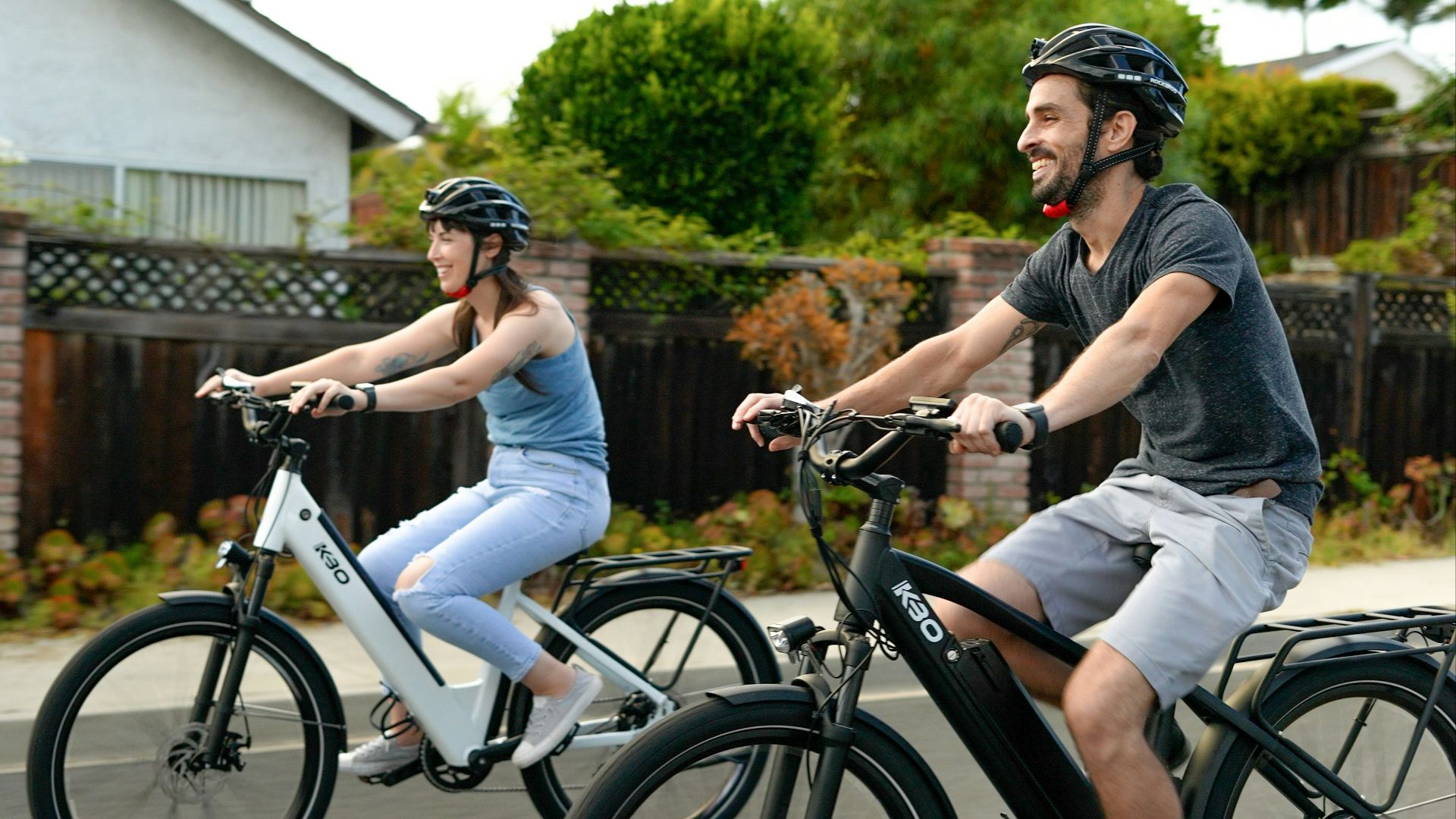man in black t-shirt riding white bicycle