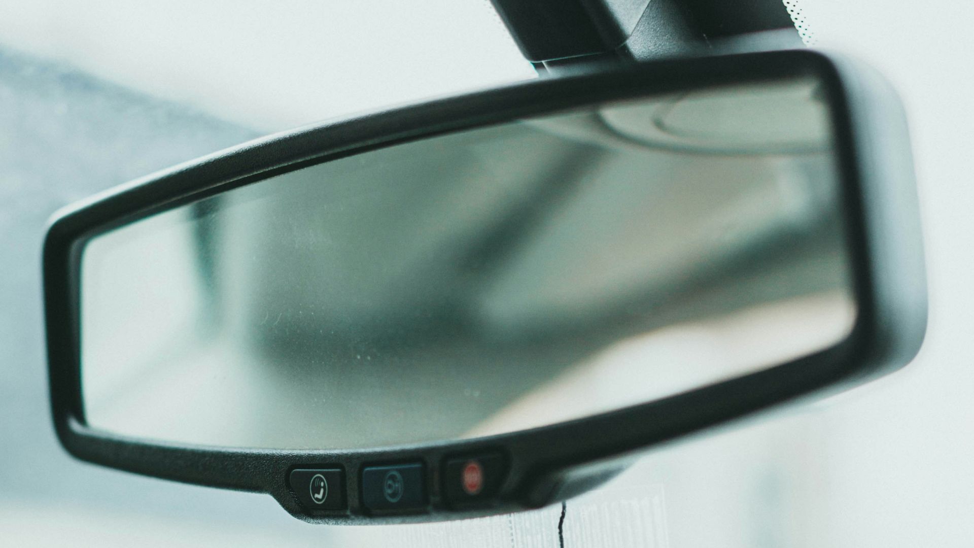 orange and yellow can on car side mirror