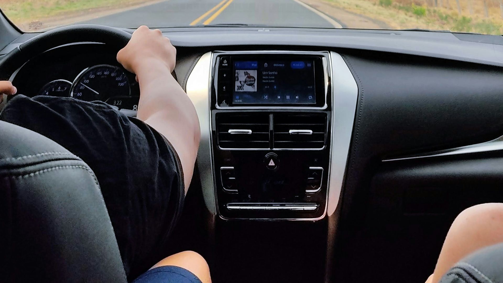 person driving car during daytime