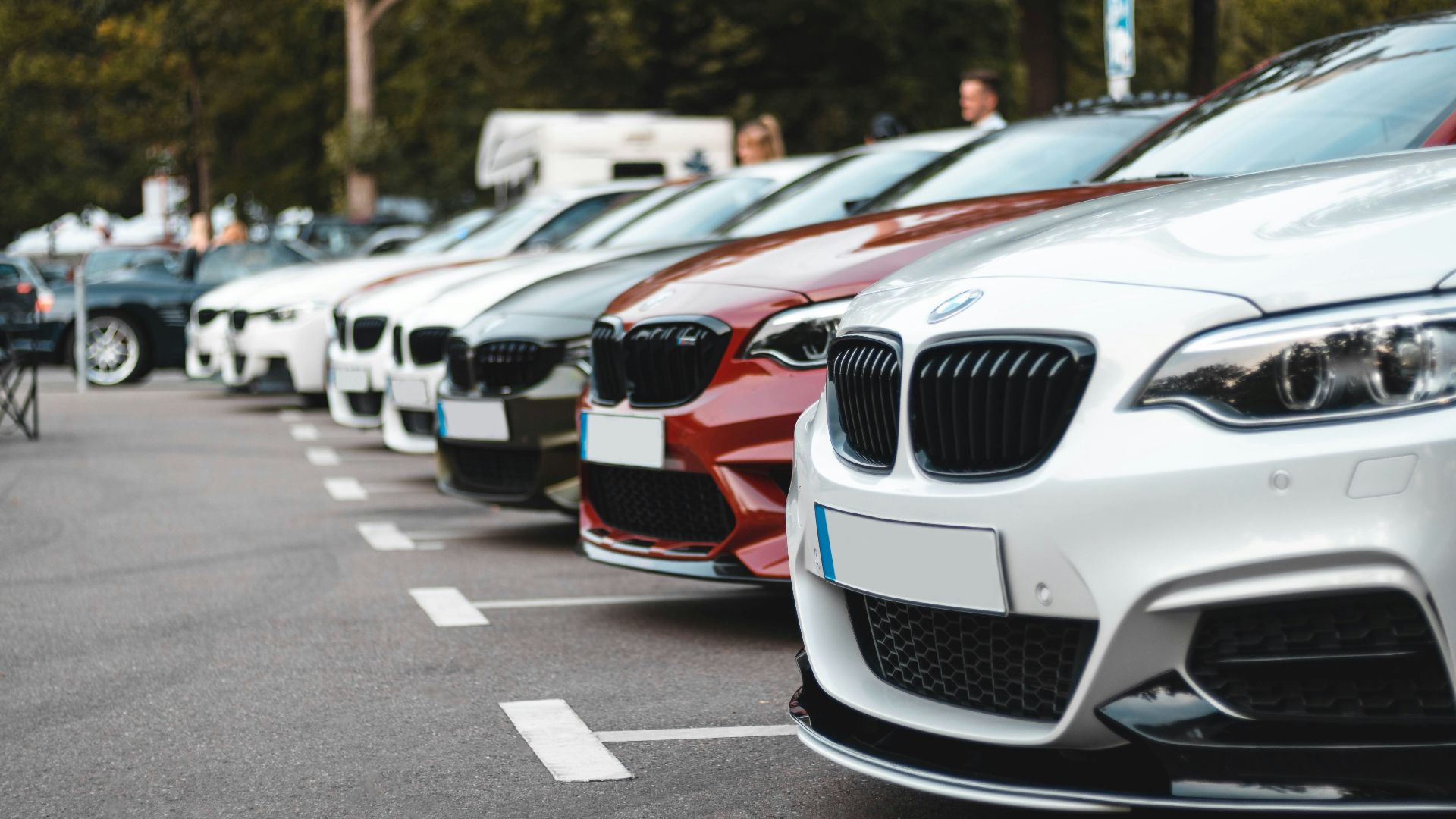 white and black bmw m 3 on road during daytime