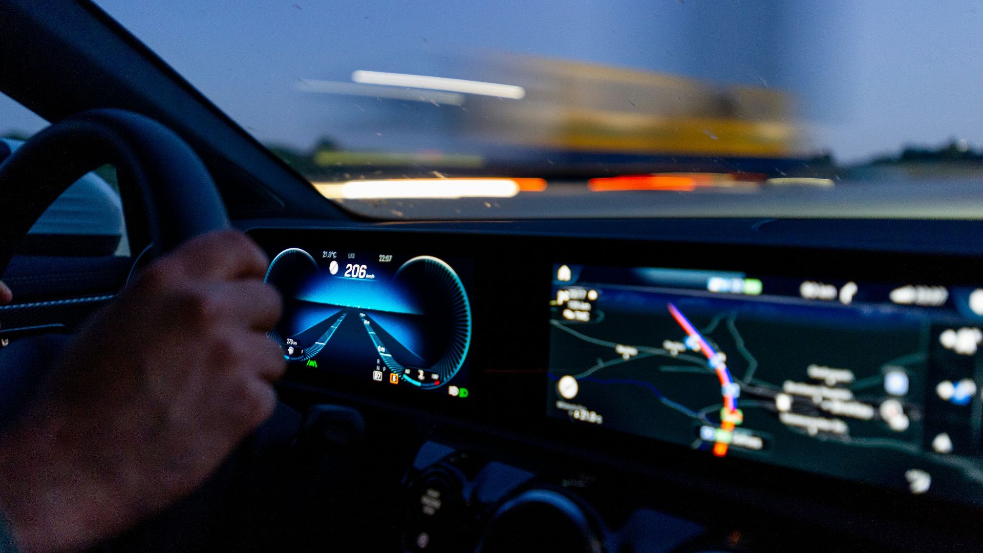 person's hand on steering wheel