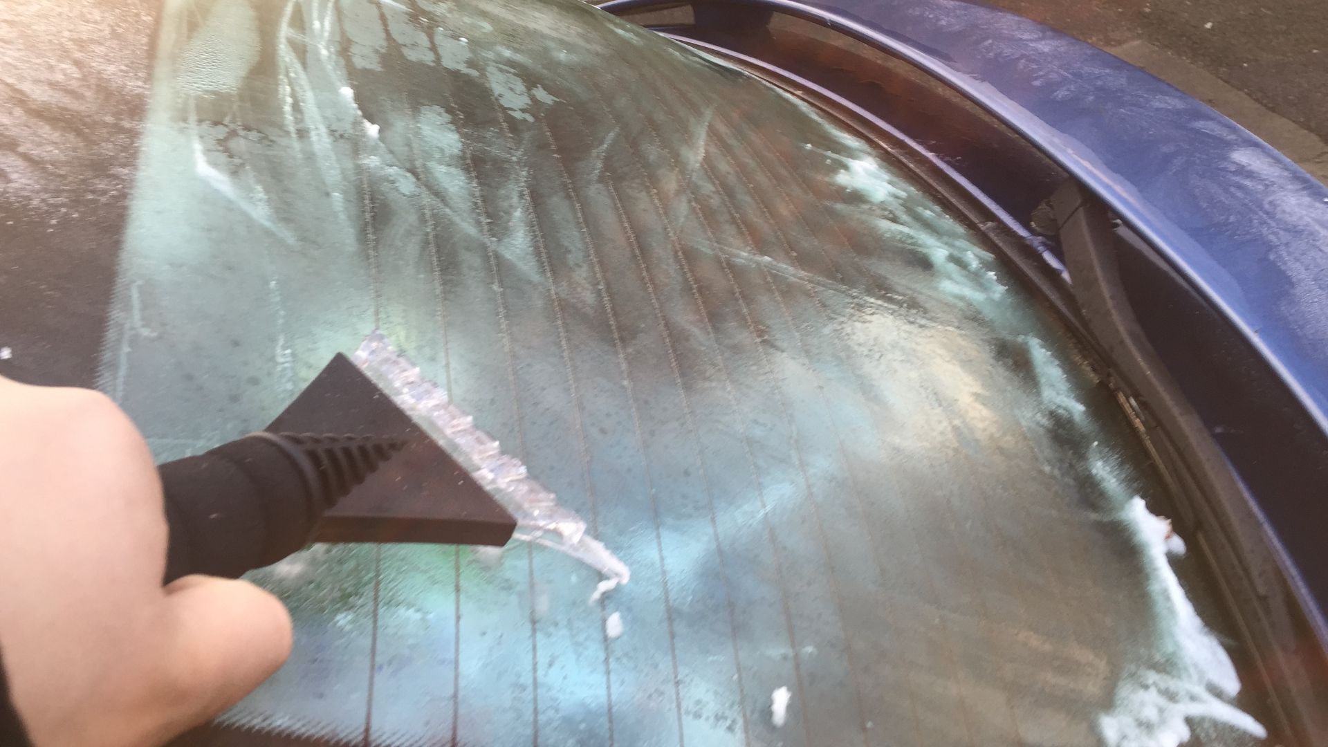 File:Ice scraper on a car window.JPG