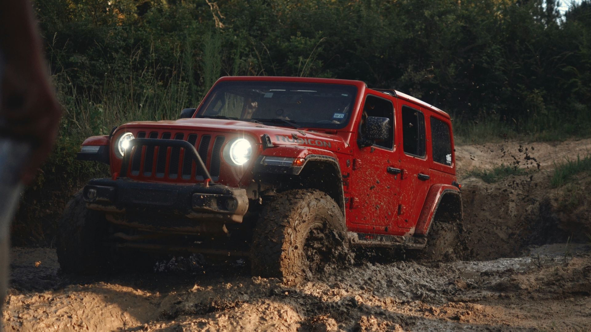 red suv on brown dirt road during daytime