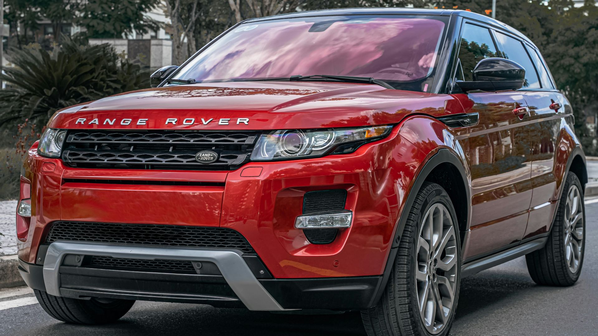 a red car parked on the side of the road