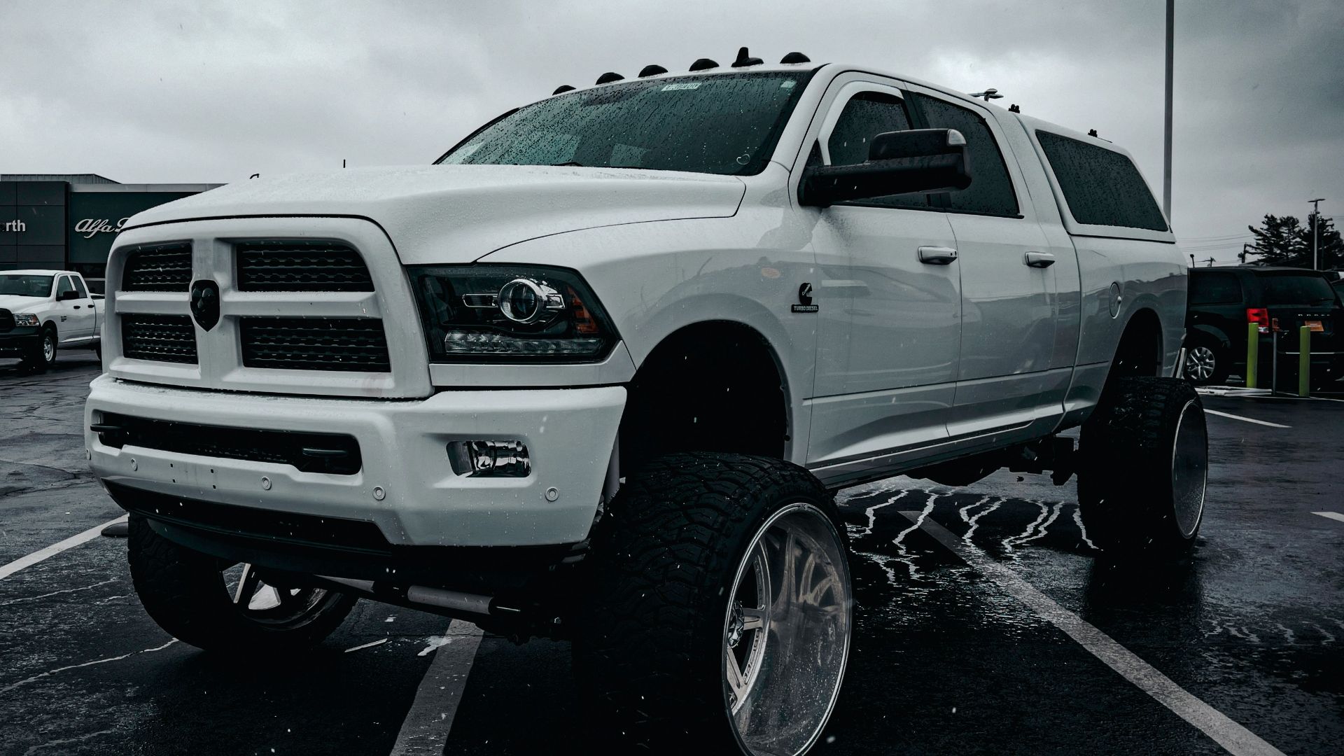 a large white truck parked in a parking lot