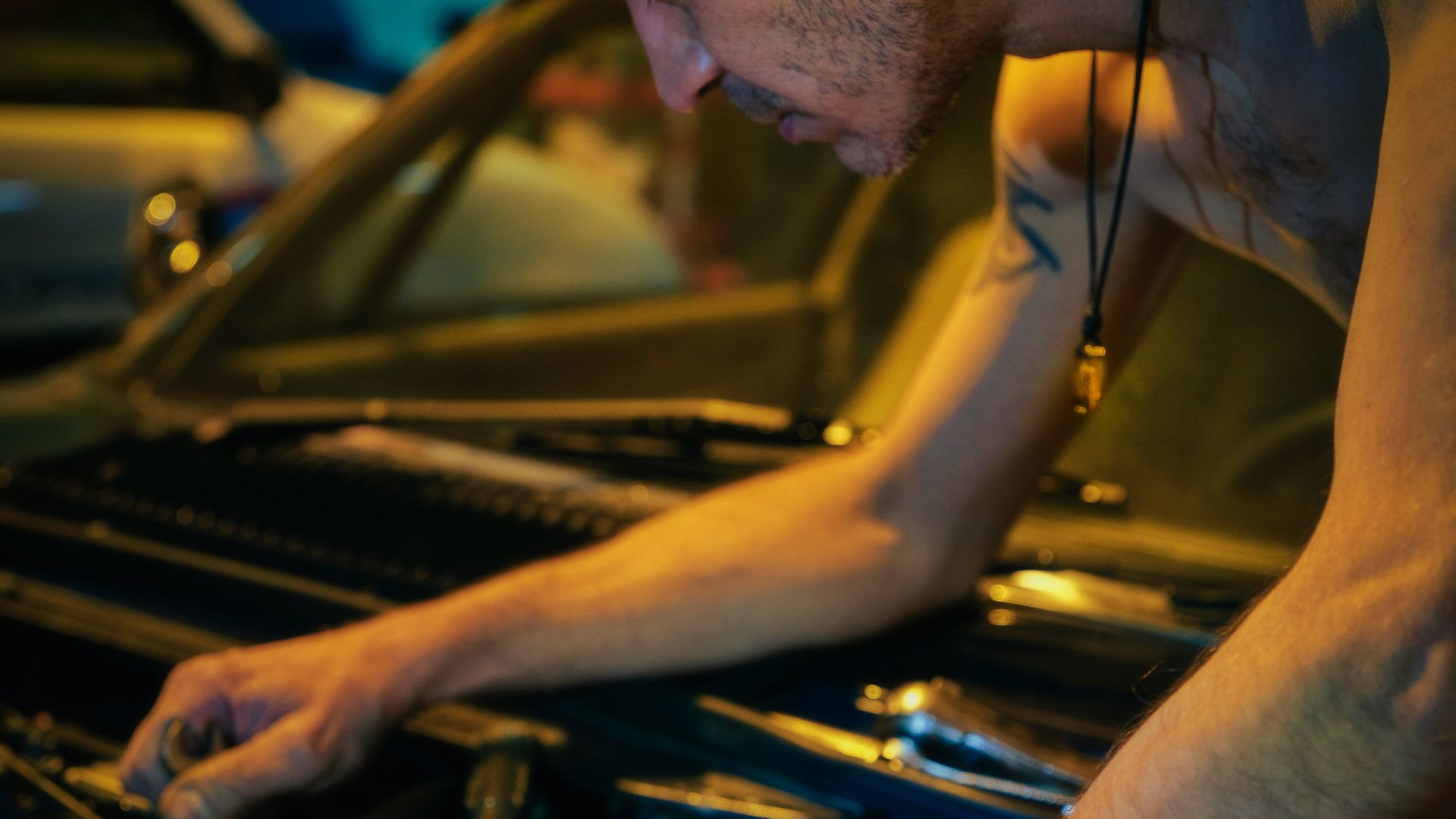man in black tank top wearing black sunglasses