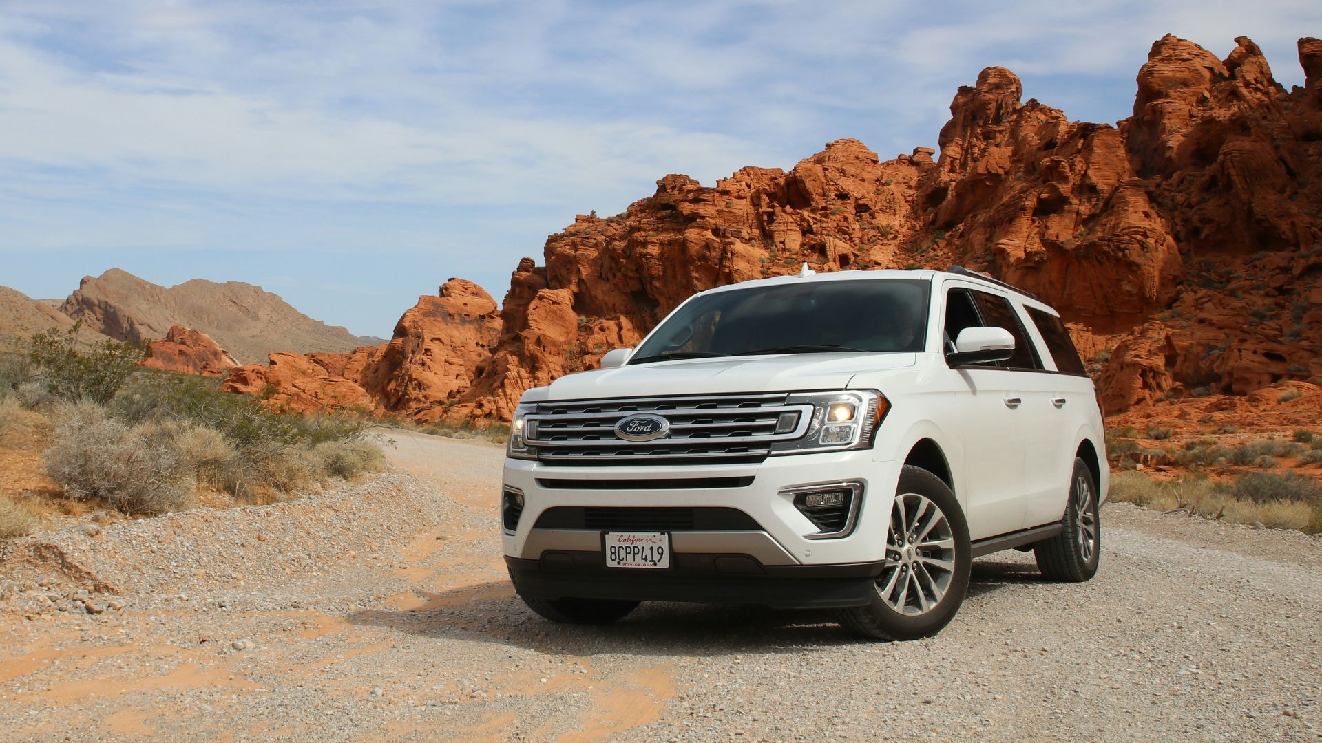 parked white Ford Explorer SUV