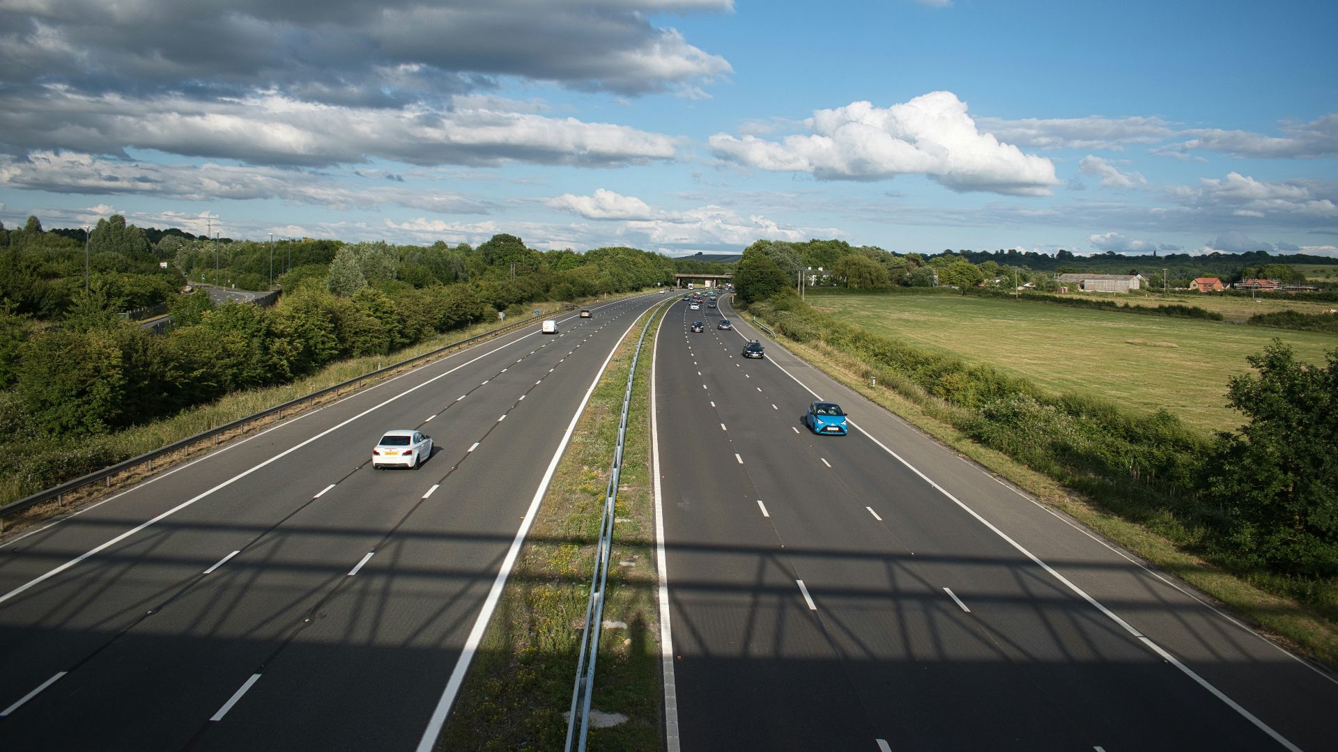 a highway with cars on it