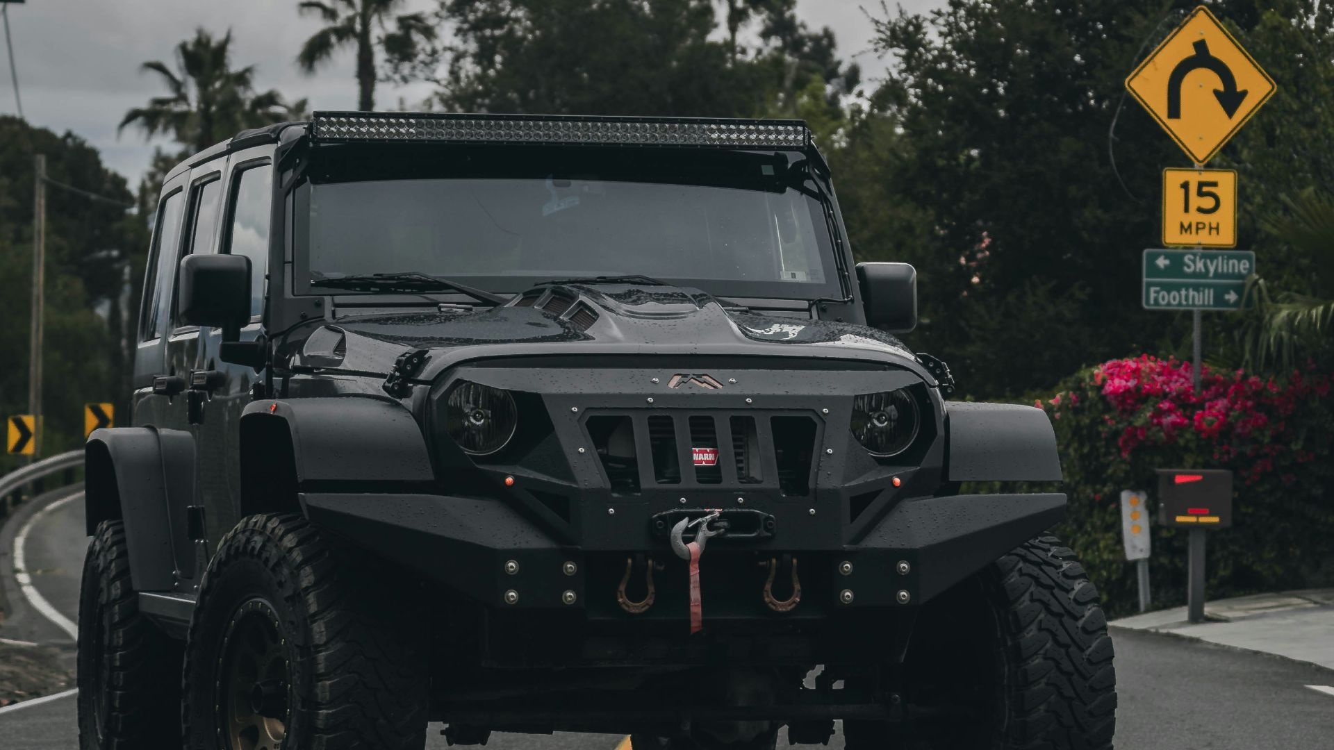 black jeep wrangler on road during daytime