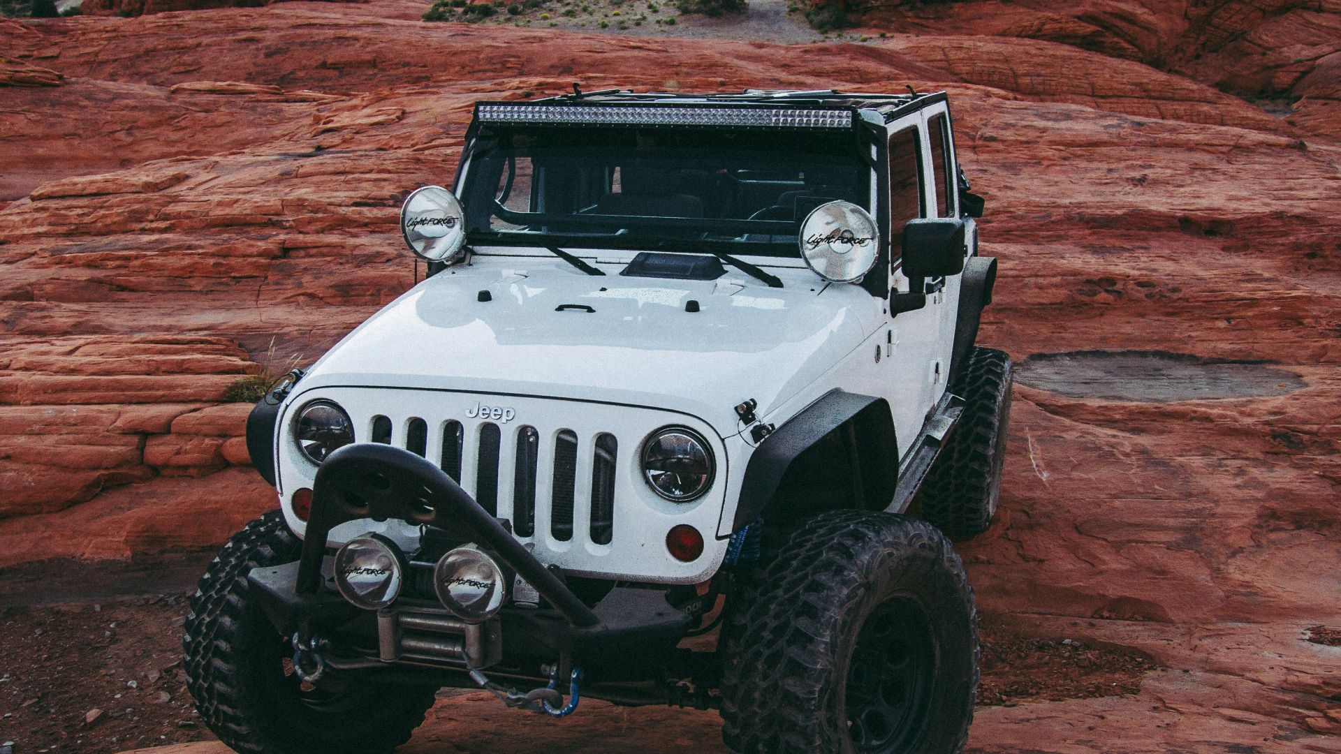 white Jeep Wrangler on land