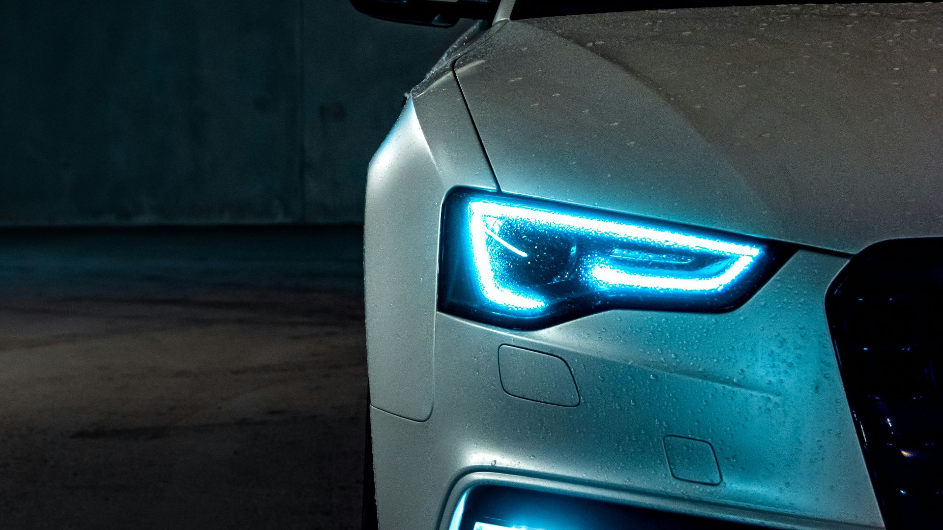 white vehicle with blue neon headlight bulb