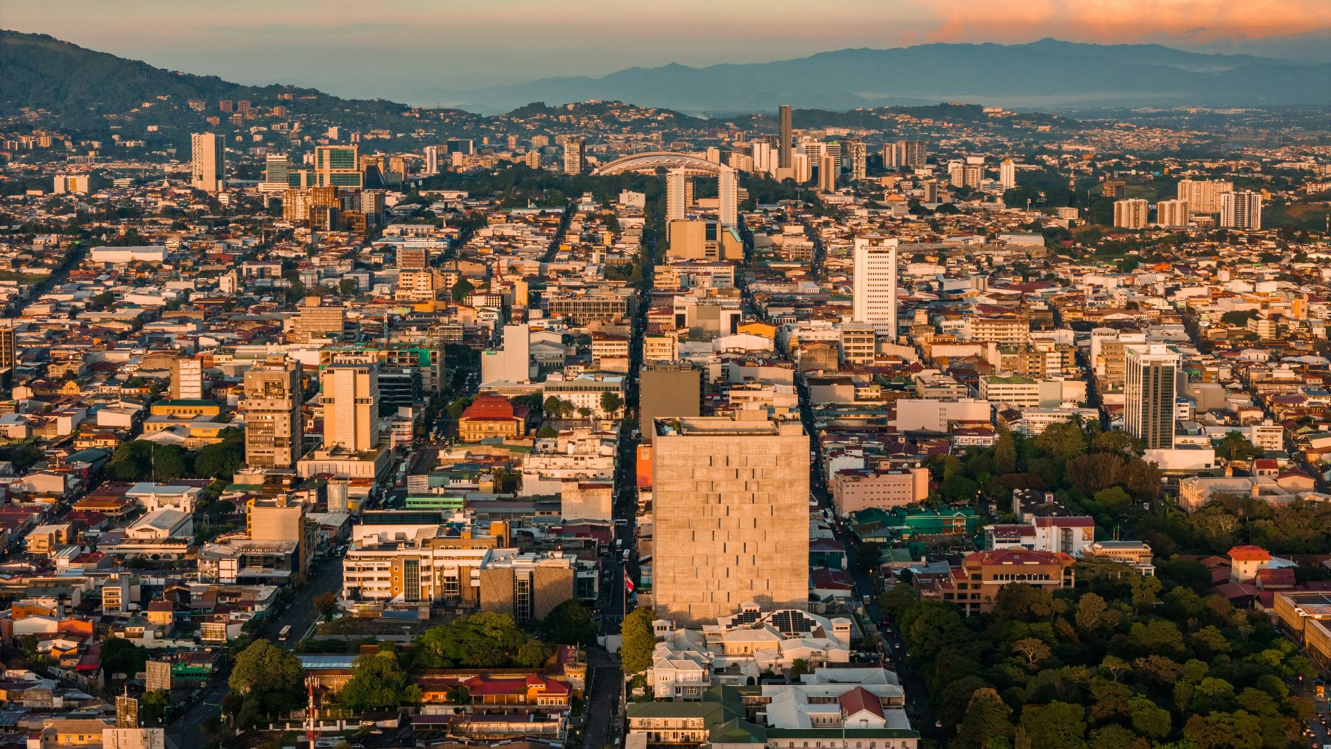 an aerial view of a city with tall buildings