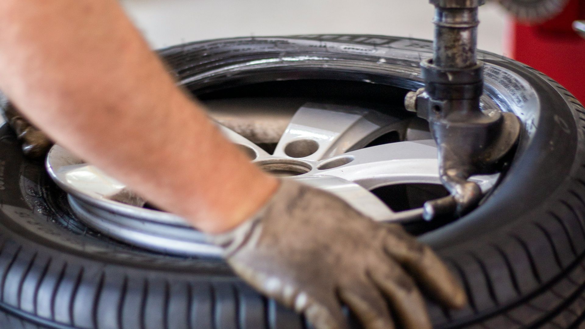 person holding black and gray metal tool