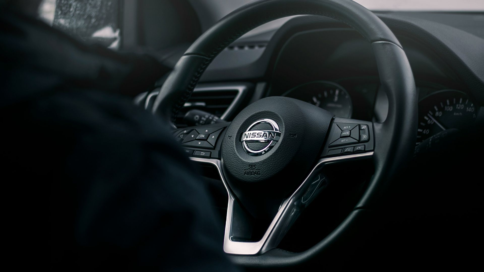 black Nissan steering wheel