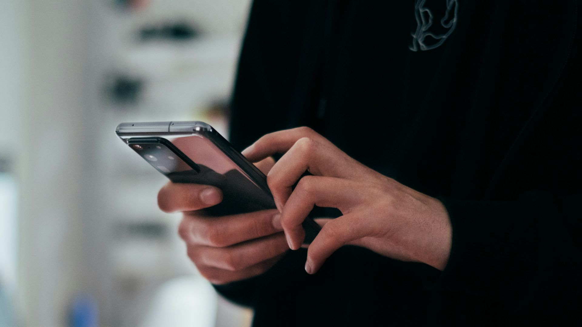 person holding black android smartphone