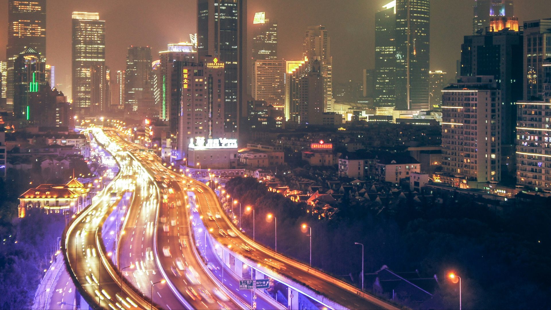 timelapse photography of building and roadway during nighttime