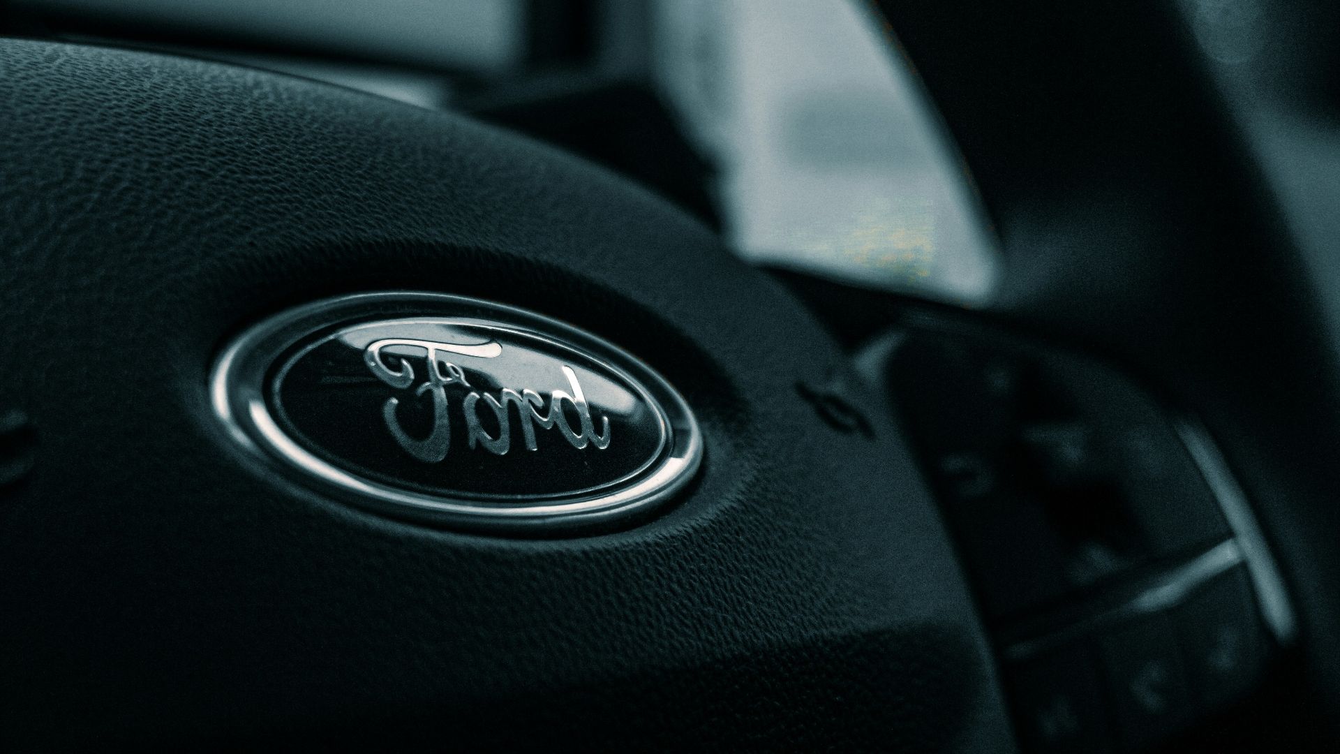 black nissan car steering wheel