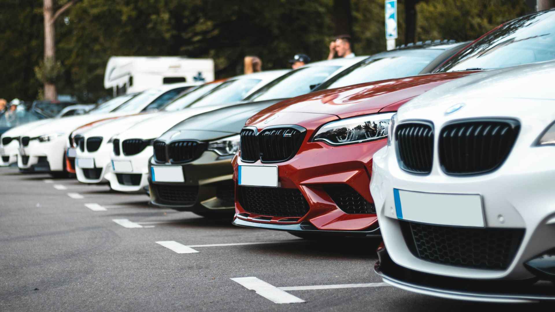 white and red bmw m 3 on road during daytime
