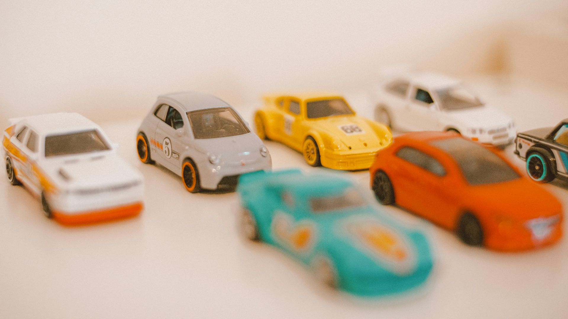 a group of toy cars sitting on top of a table