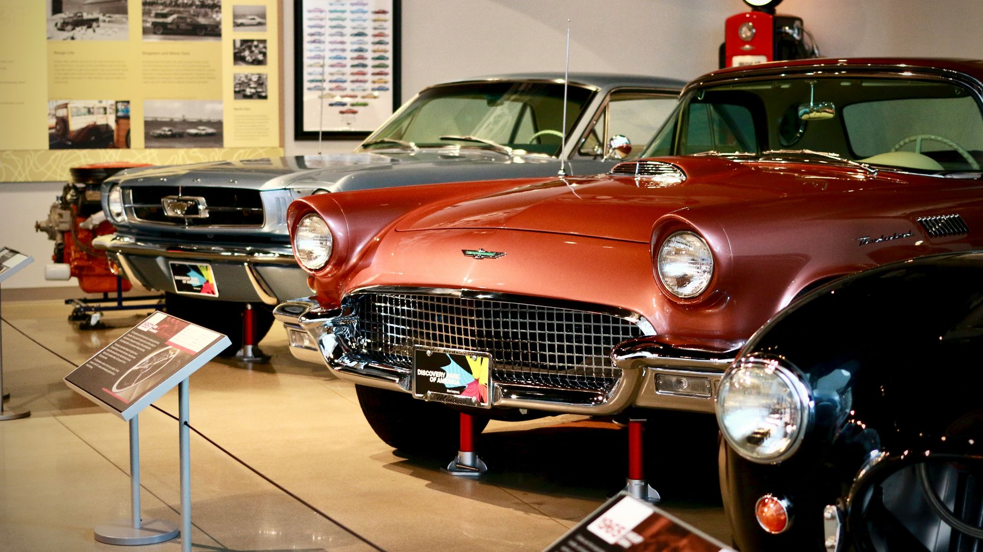 red classic car in a parking lot