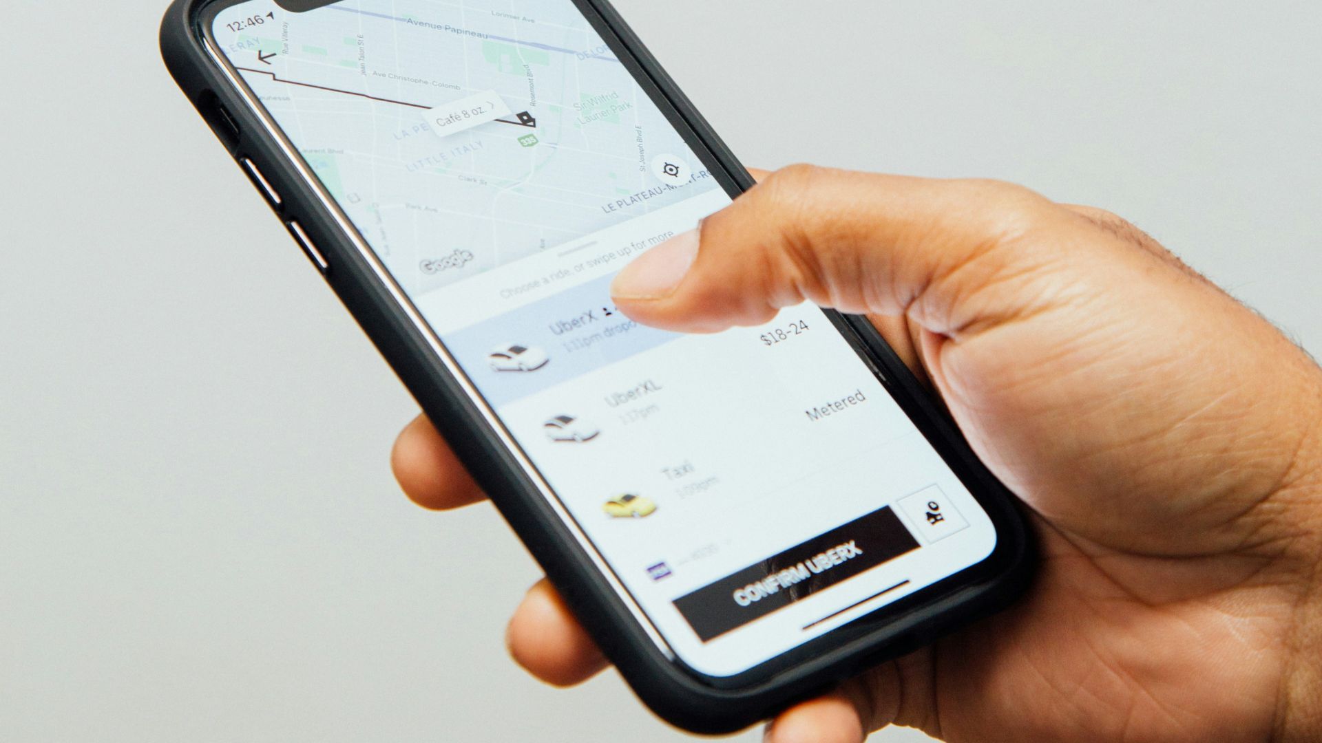 a person holding a cell phone in their hand