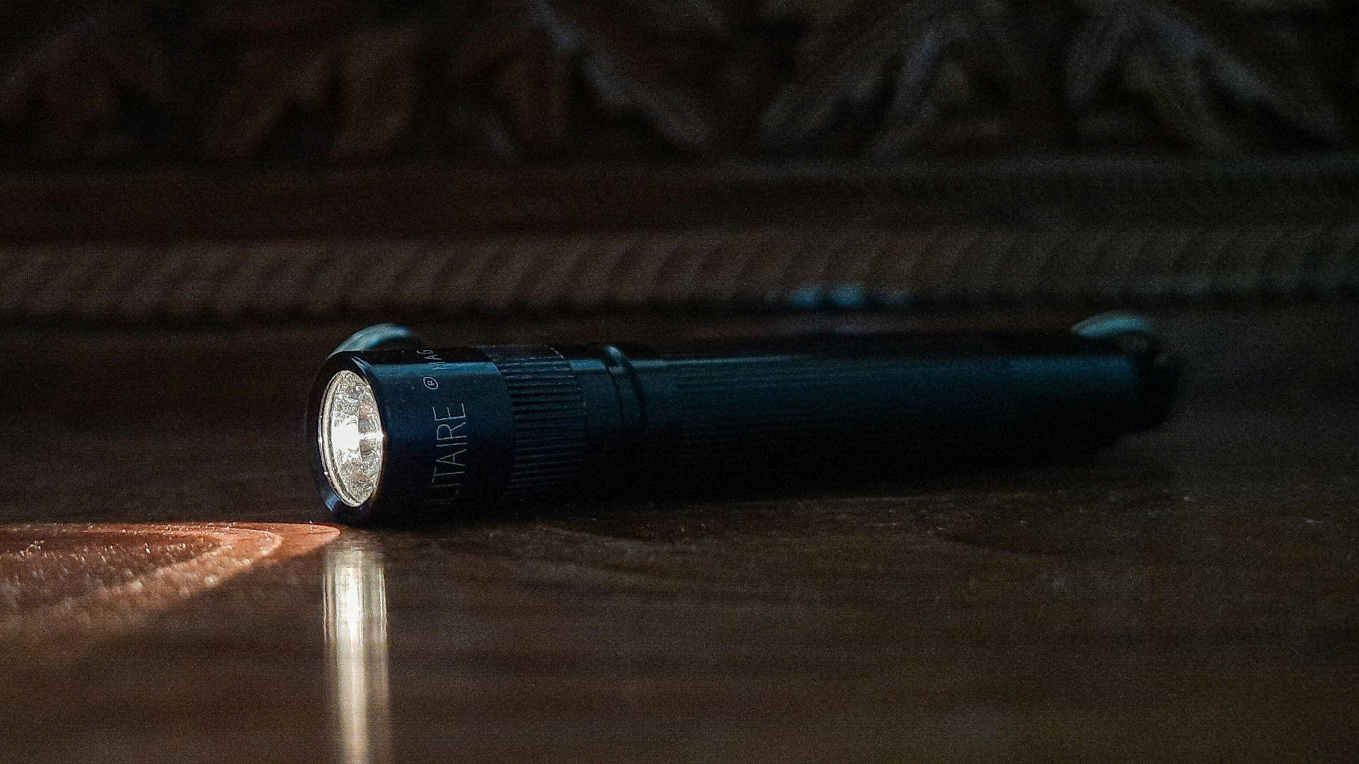 a flashlight sitting on the floor of a room