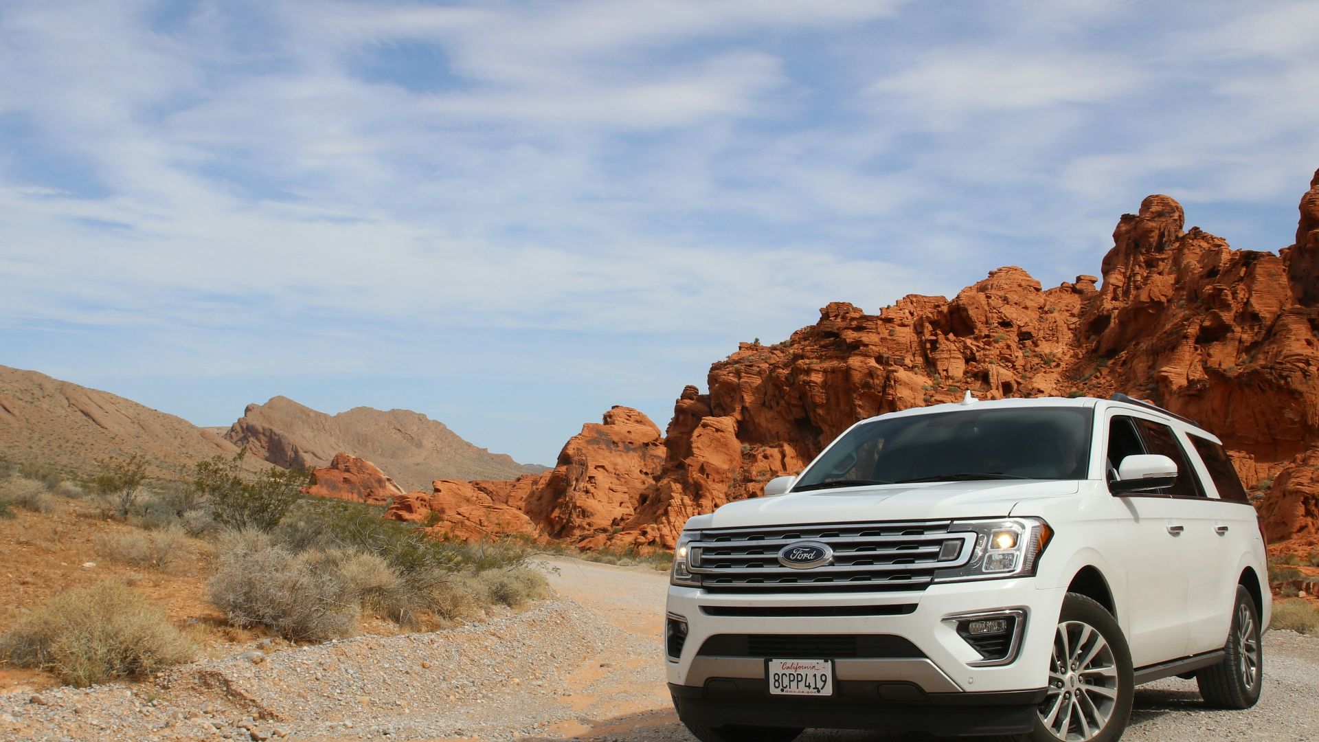 parked white Ford Explorer SUV