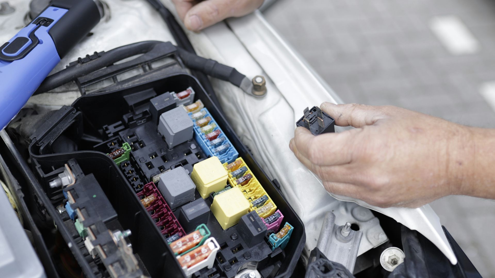 a man is working on a car's engine