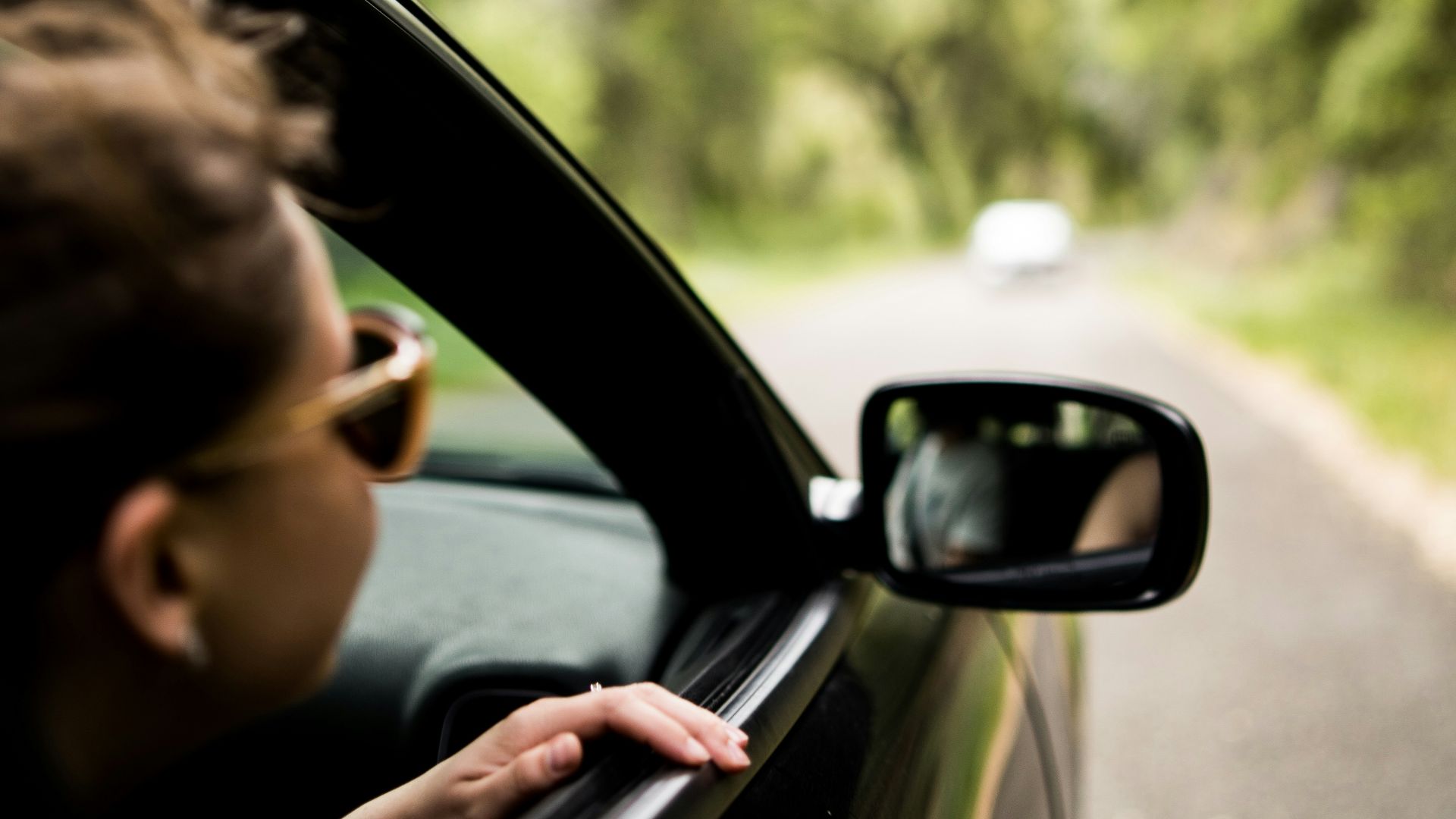 woman sitting inside vehicle
