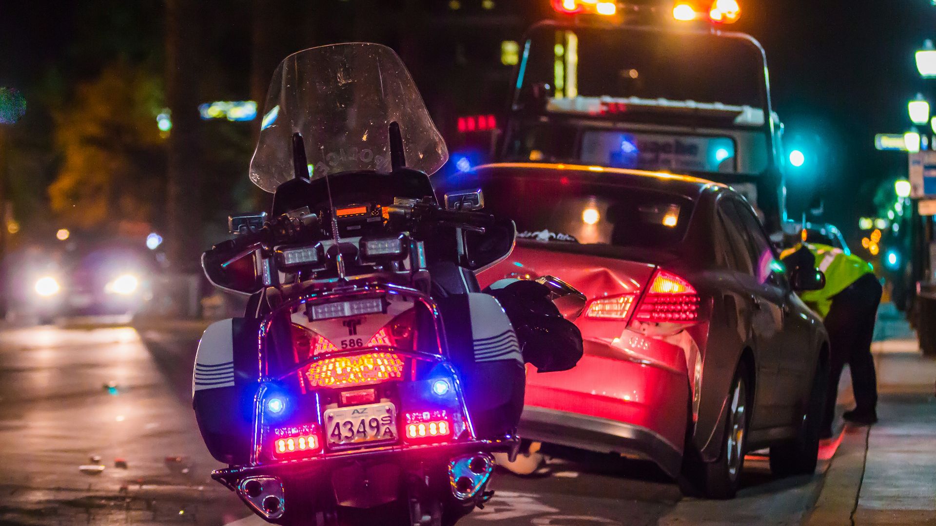 policeman leaning on sports car's window